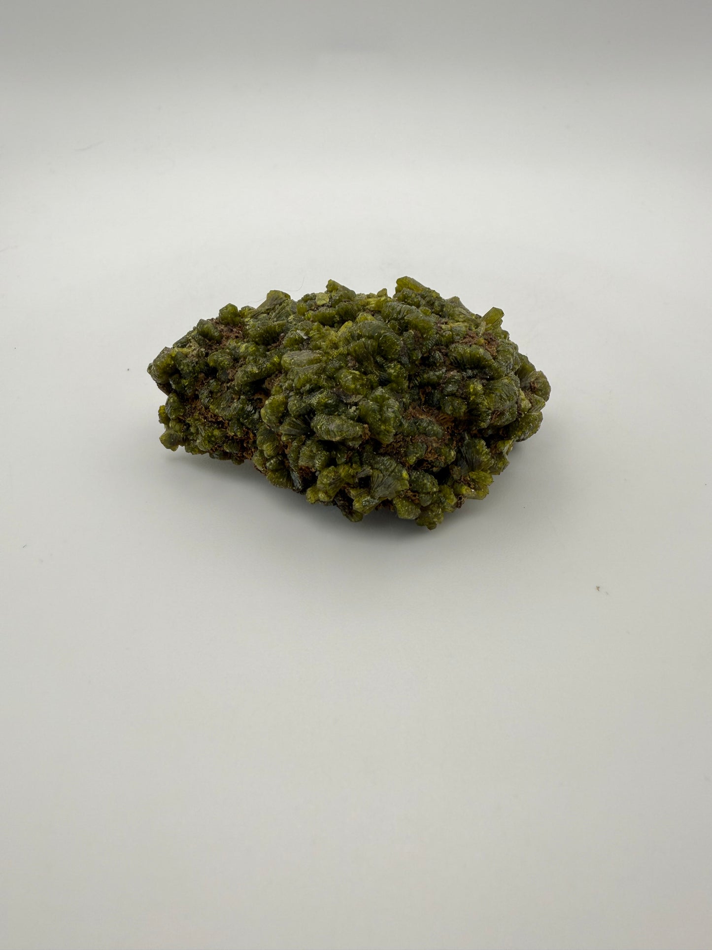 Epidote crystal cluster with good green color.