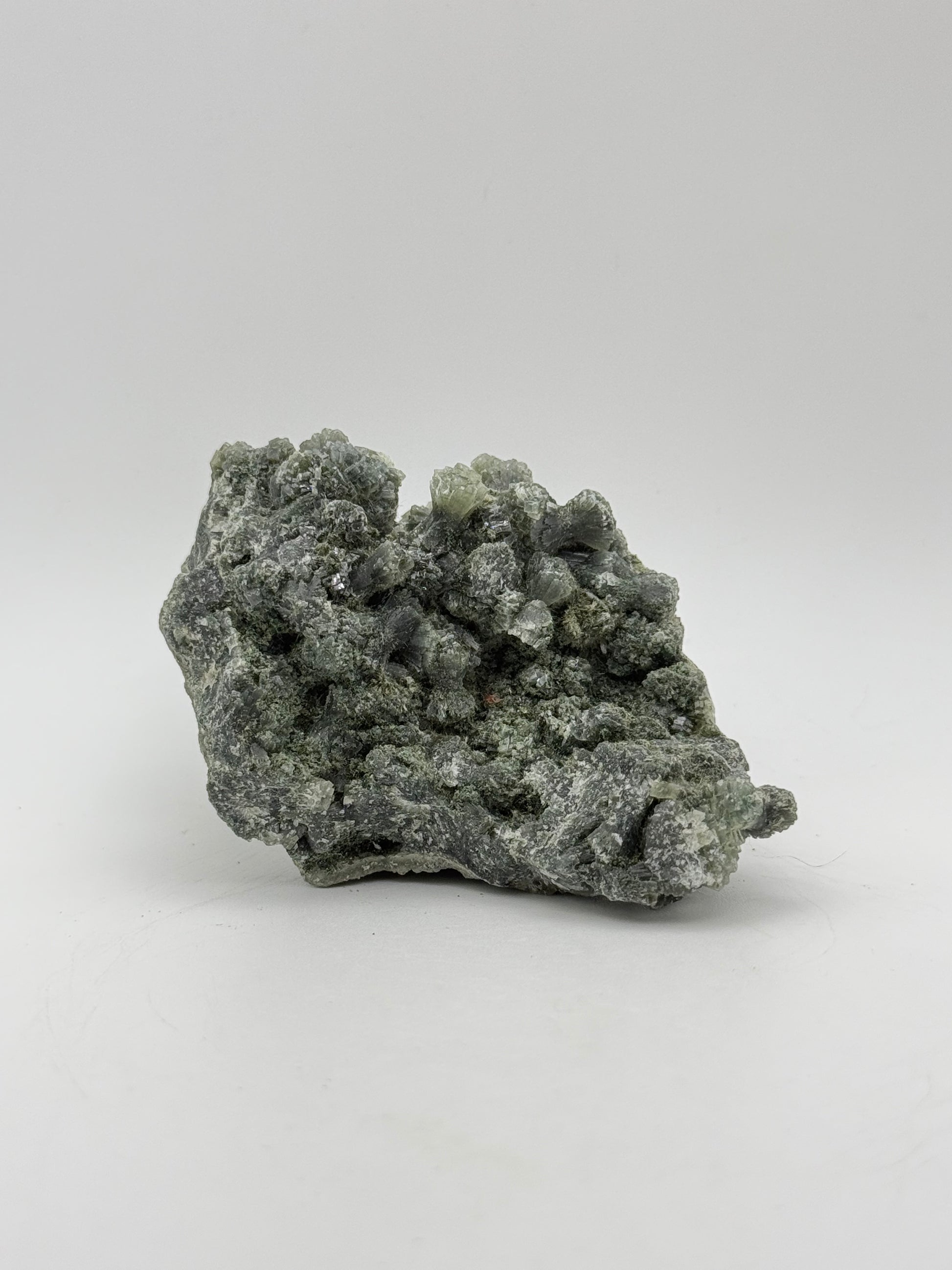 Raw prehnite specimen with amazing green color.