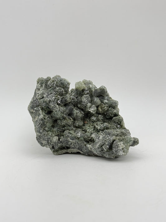 Raw prehnite specimen with amazing green color.