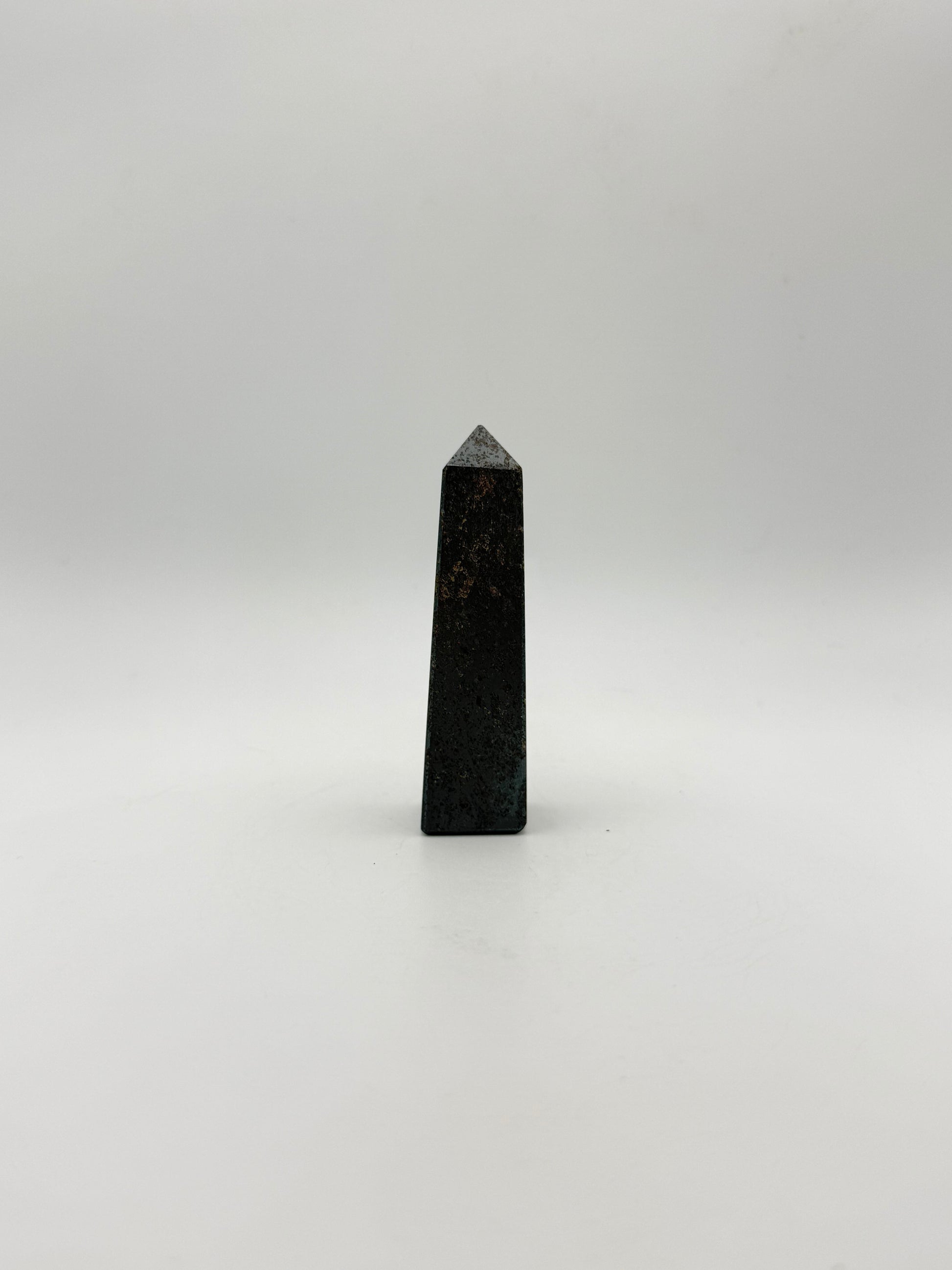 four sided hematite tower.