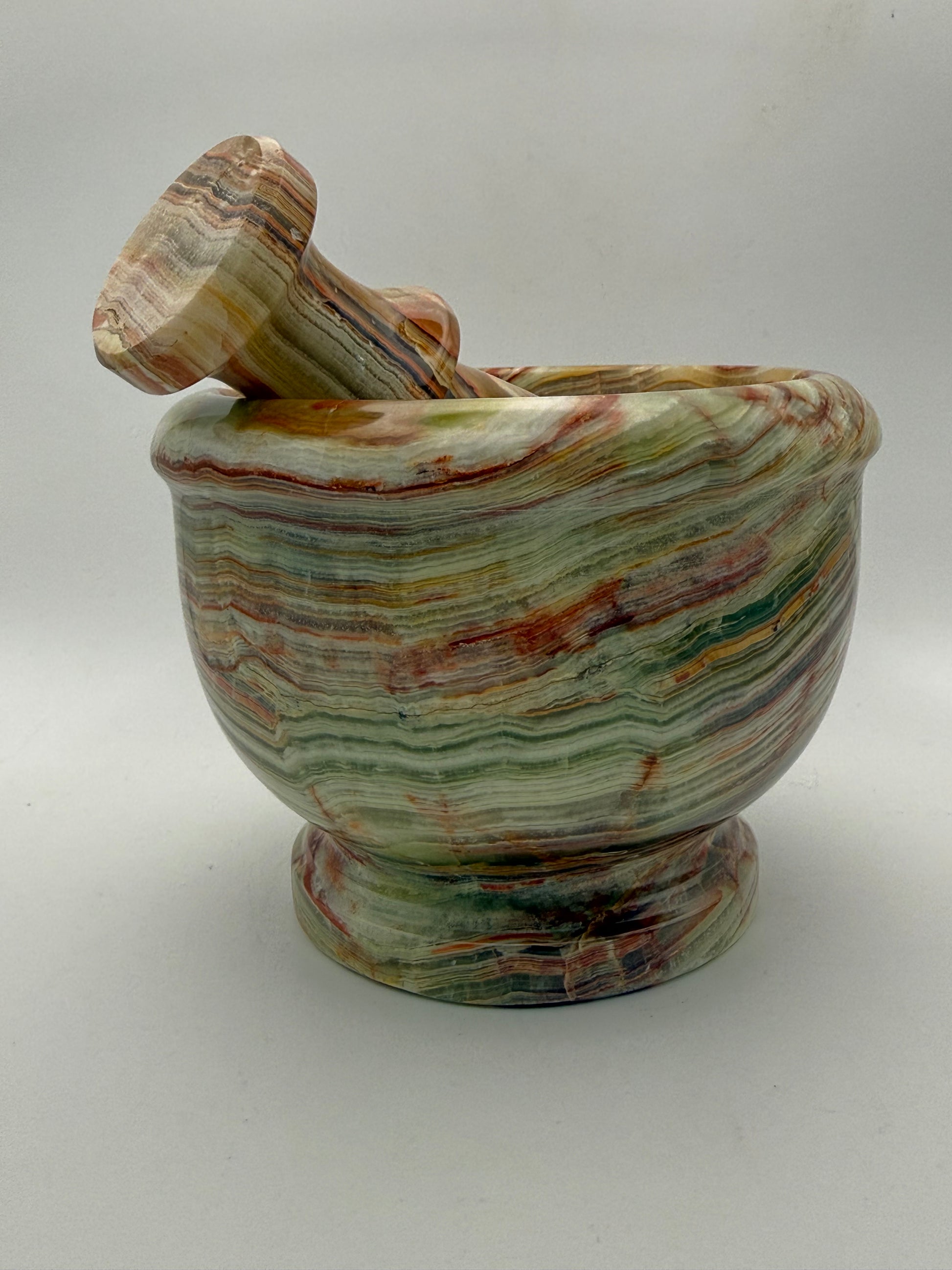 Mortar and pestle made out of onyx stone.