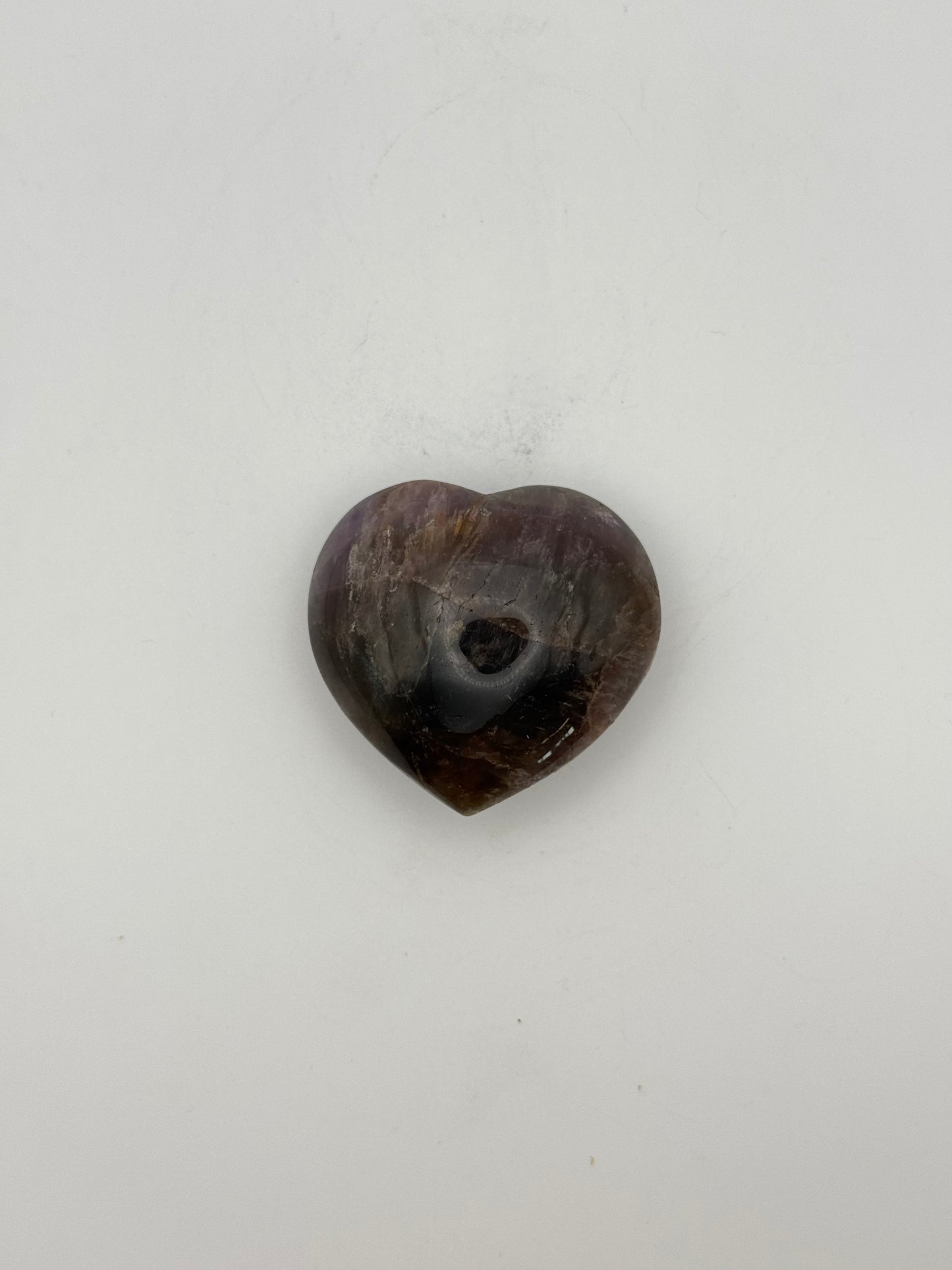 Polished super 7 in the shape of a heart.