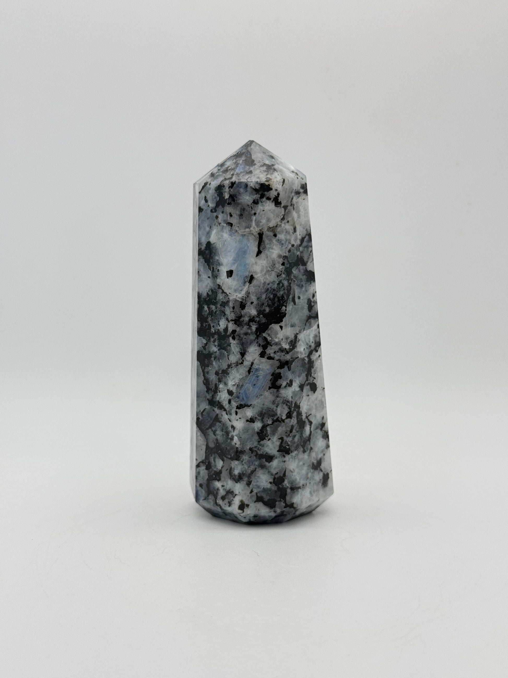 Polished rainbow moonstone tower with nice flashes of blue.