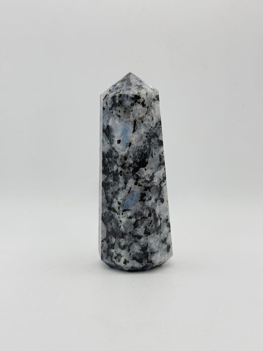 Polished rainbow moonstone tower with nice flashes of blue.