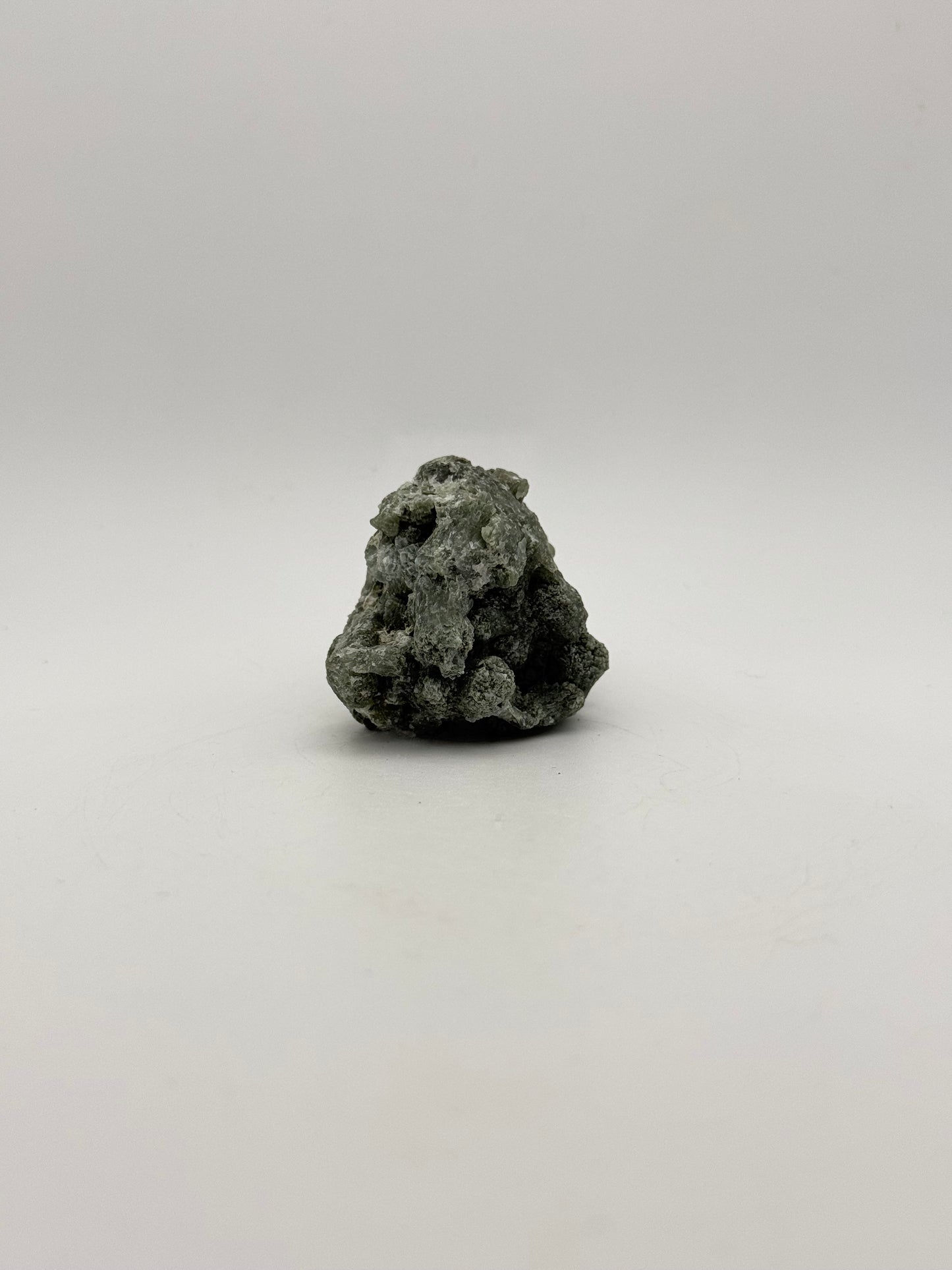 Raw prehnite specimen with amazing green color.