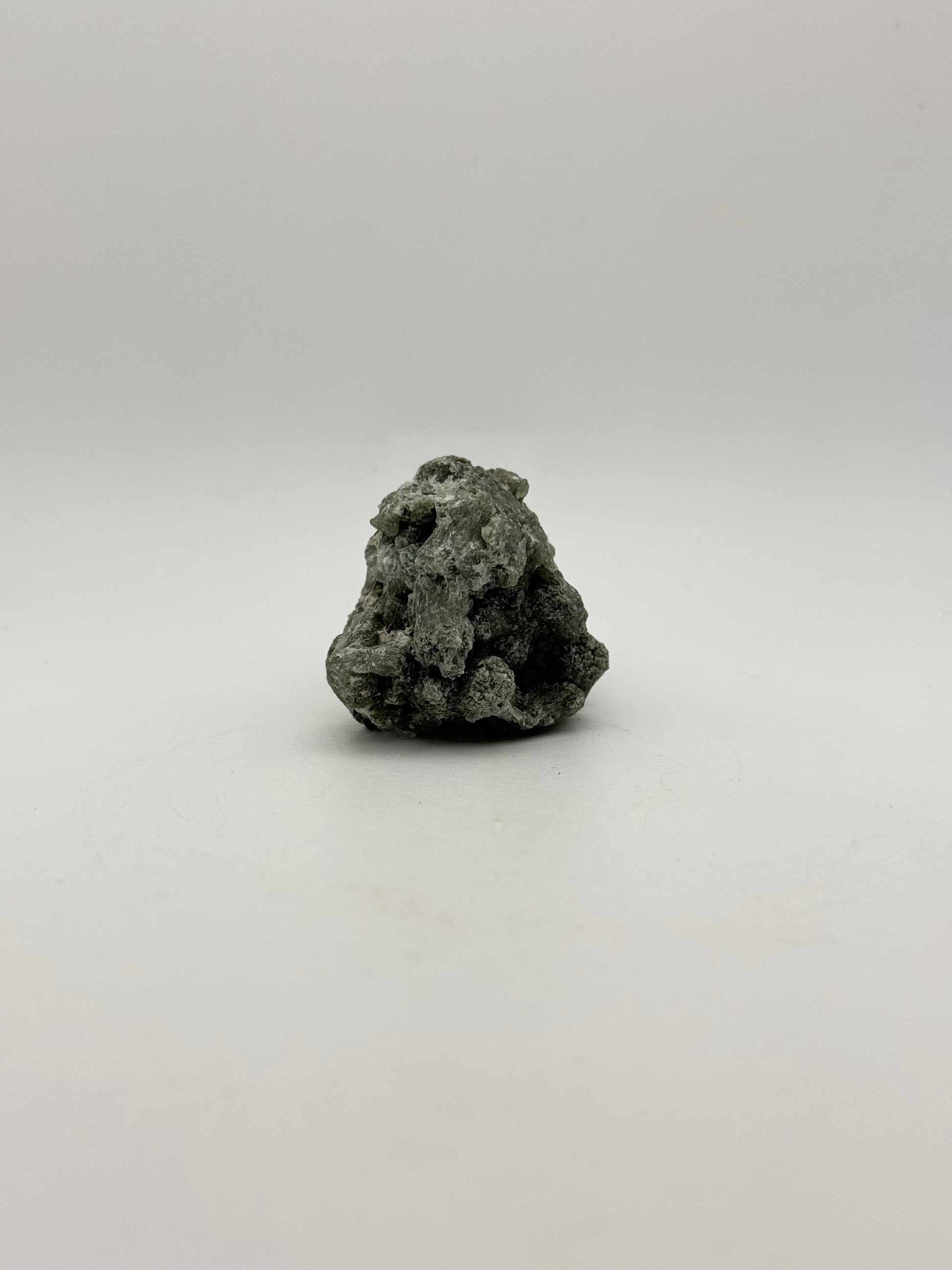 Raw prehnite specimen with amazing green color.