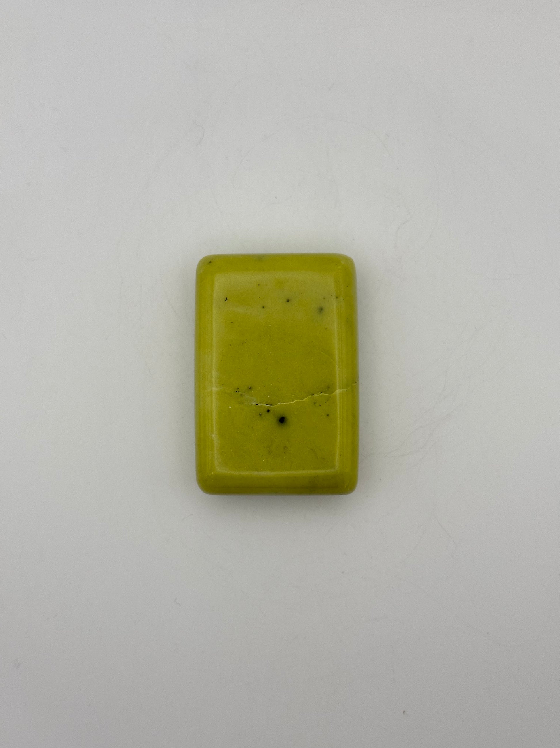Polished healerite in the shape of a rectangular soap.