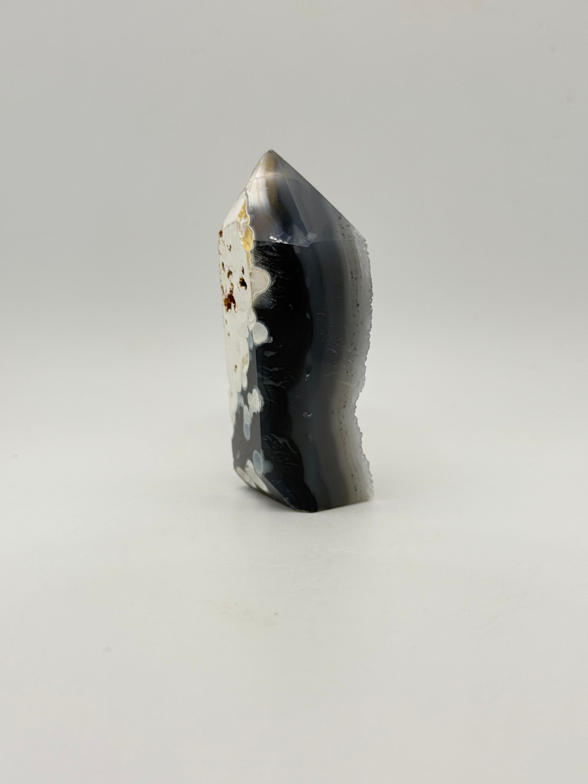 Polished druzy agate tower. About 3  inches tall.