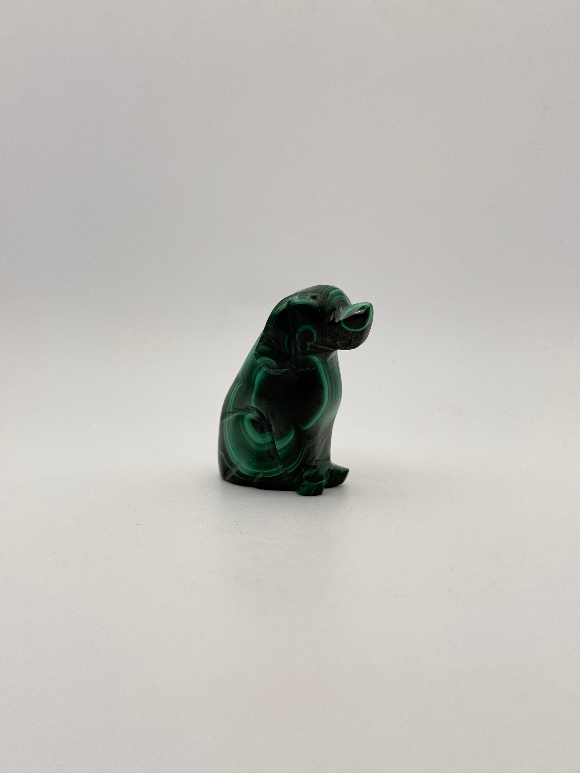 Polished malachite dog carving.