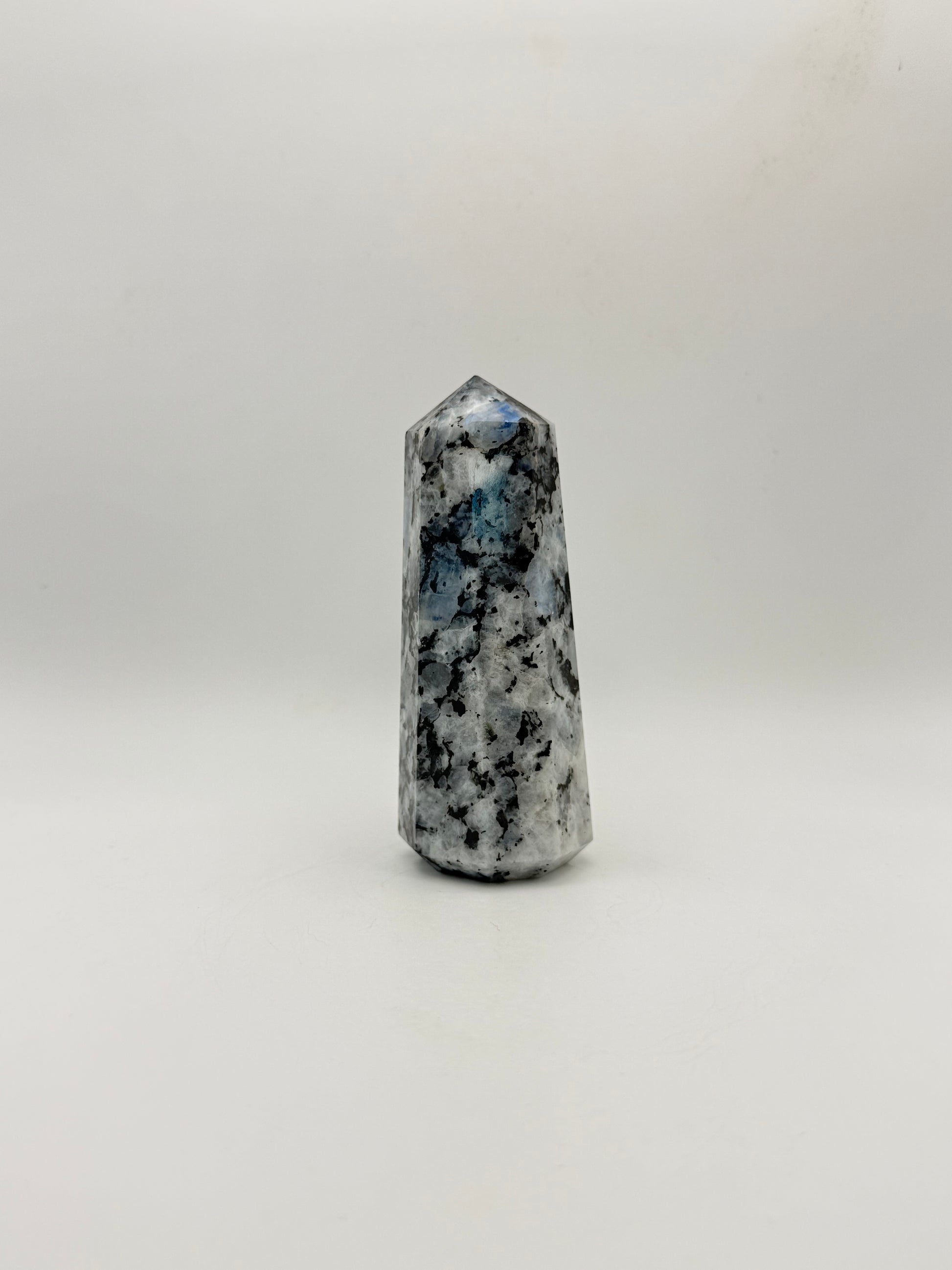 Polished rainbow moonstone tower with nice flashes of blue.