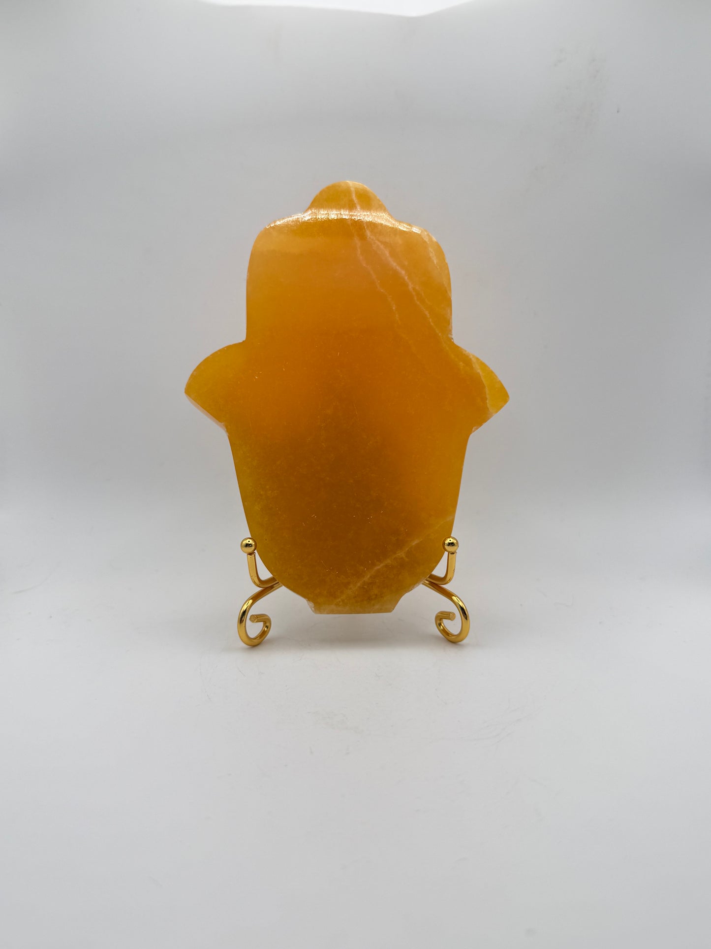 Polished Orange calcite hasma carving.