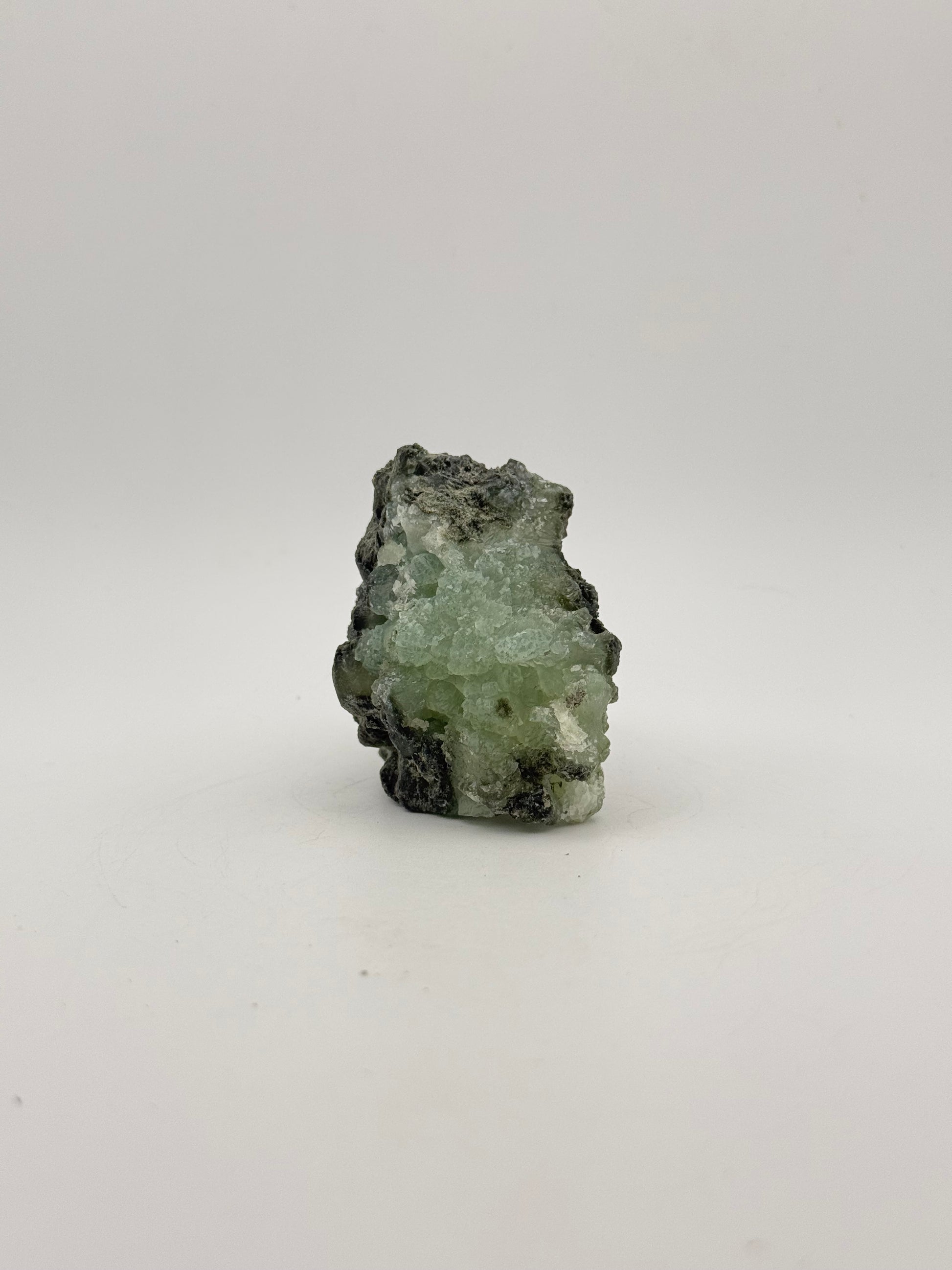 Raw Prehnite specimen with amazing green color.