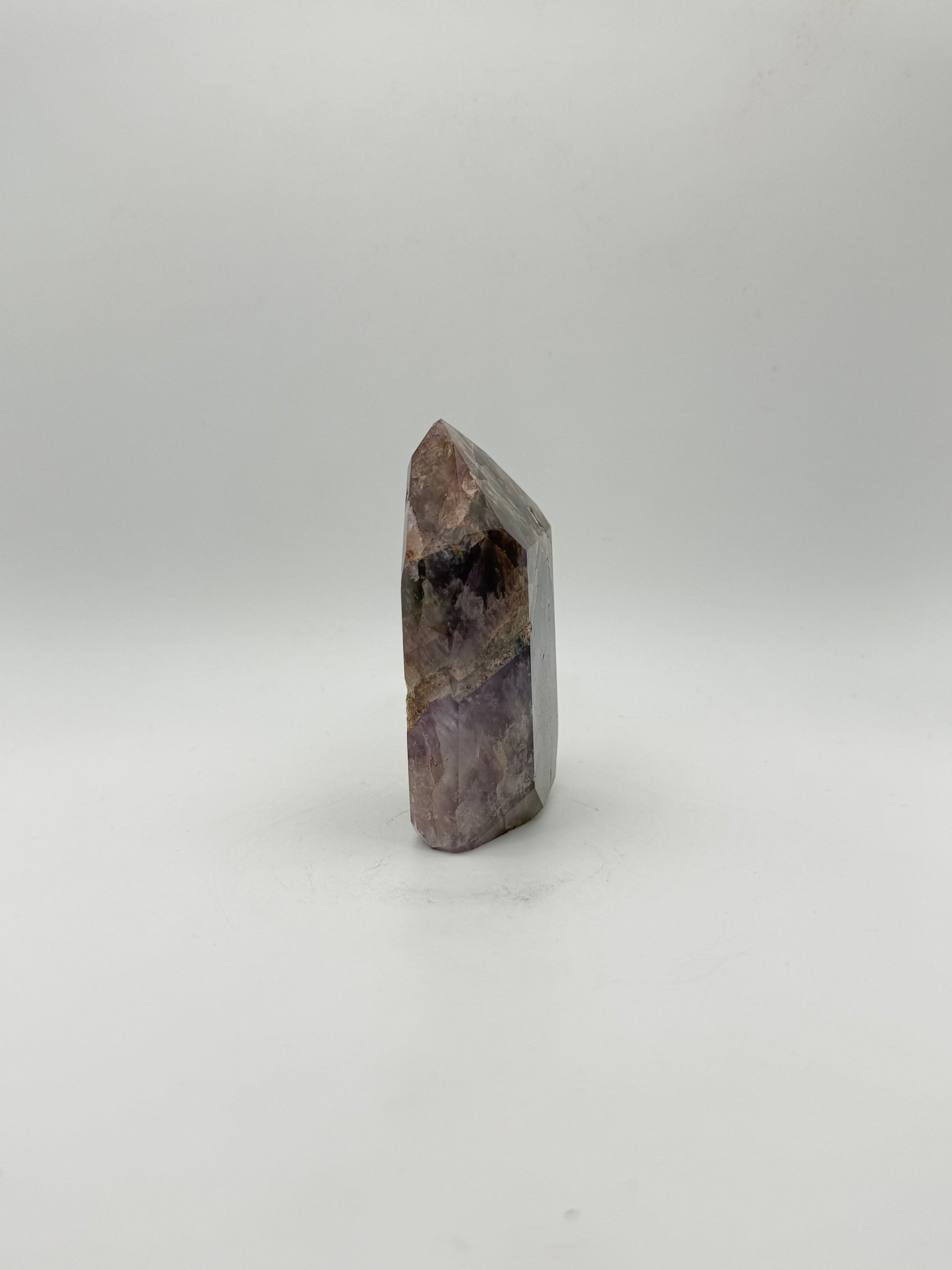 Polished super 7 in the shape of a tower.