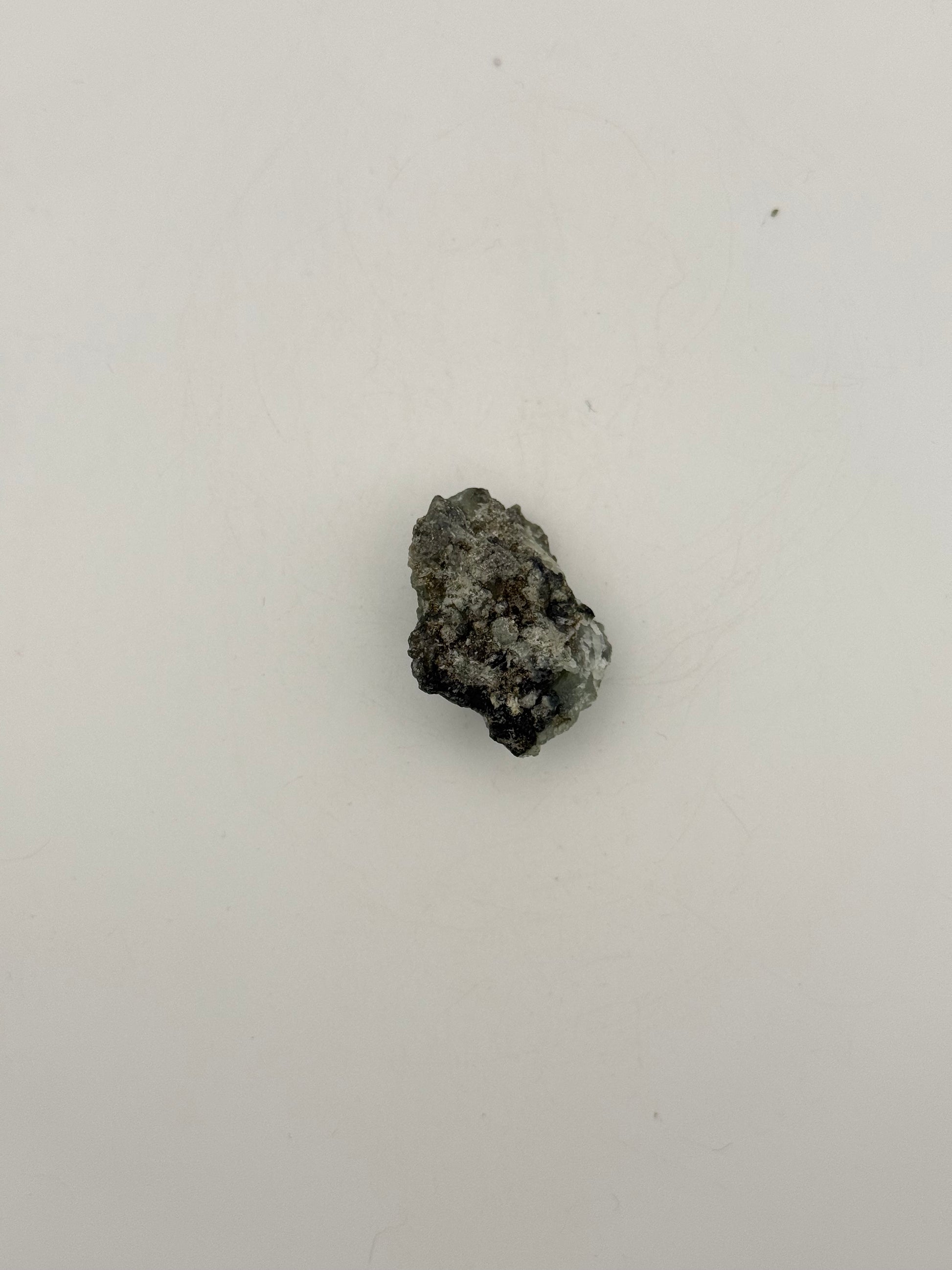 Raw prehnite specimen with amazing green color.