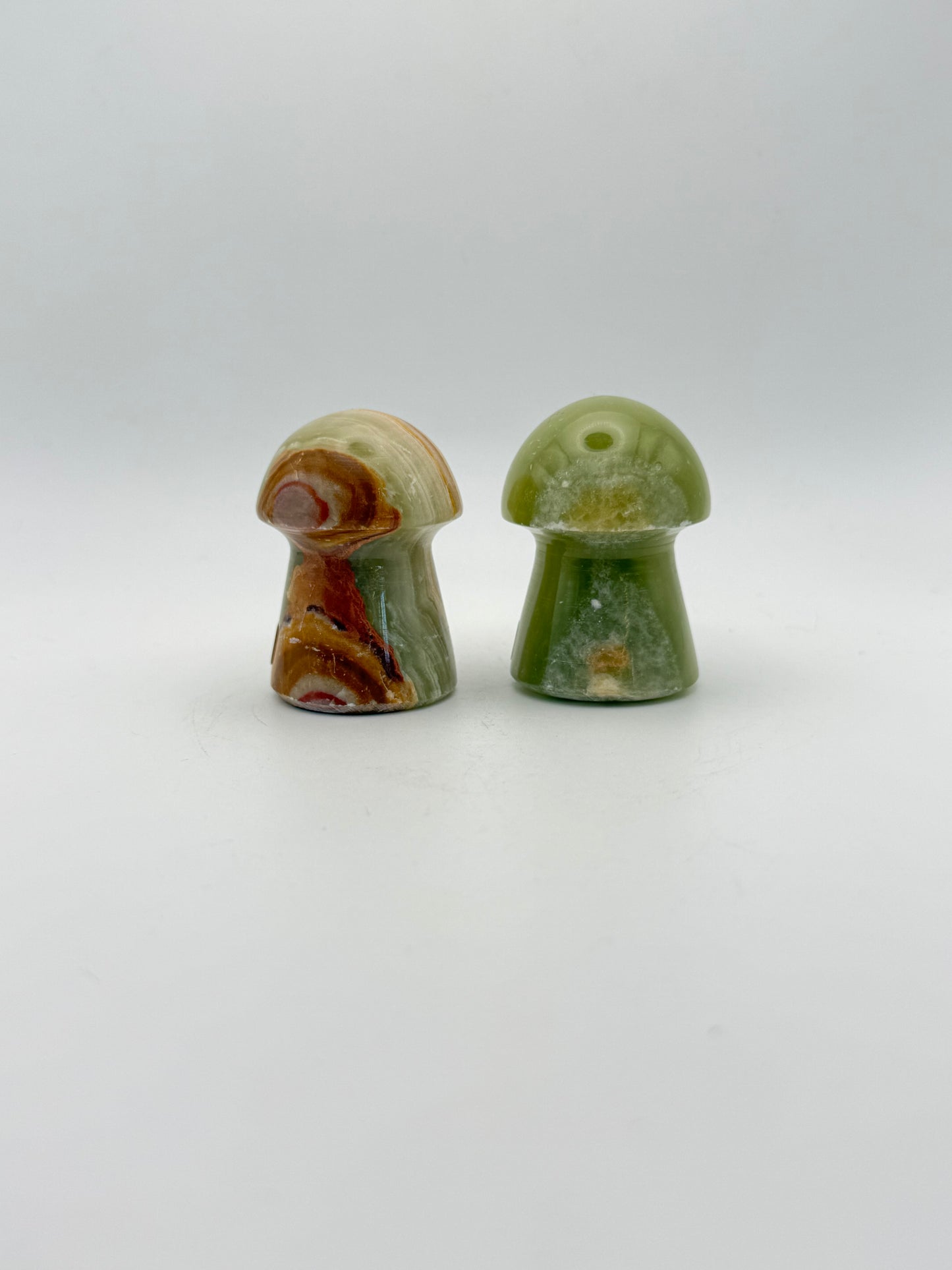 Two onyx mushroom-shaped stones.