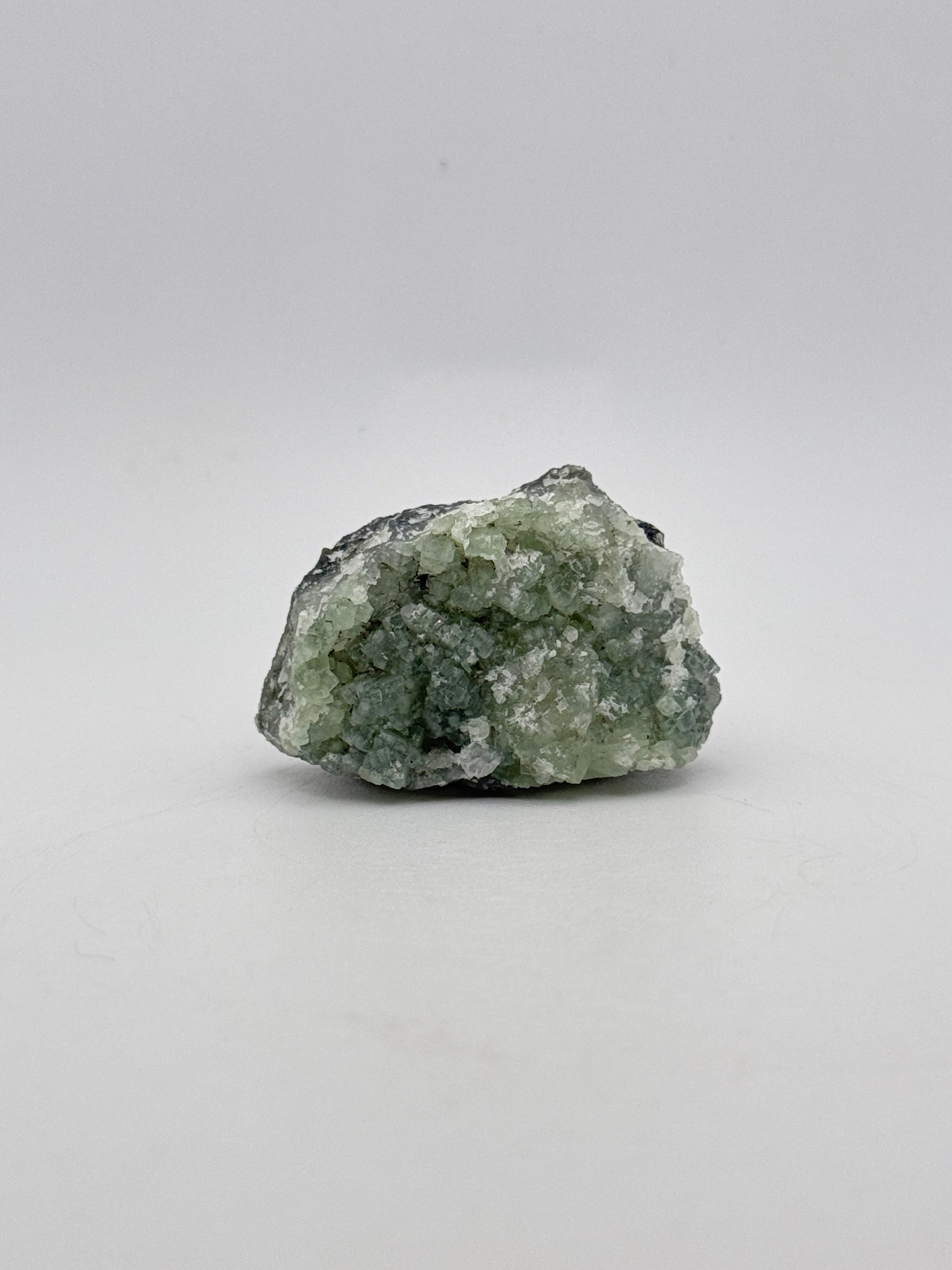 Raw Prehnite specimen with amazing green color.