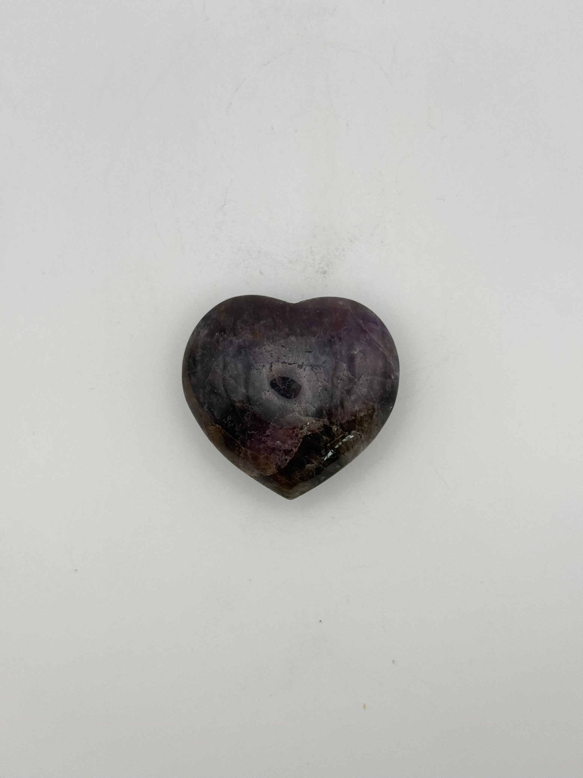 Polished super 7 in the shape of a heart.
