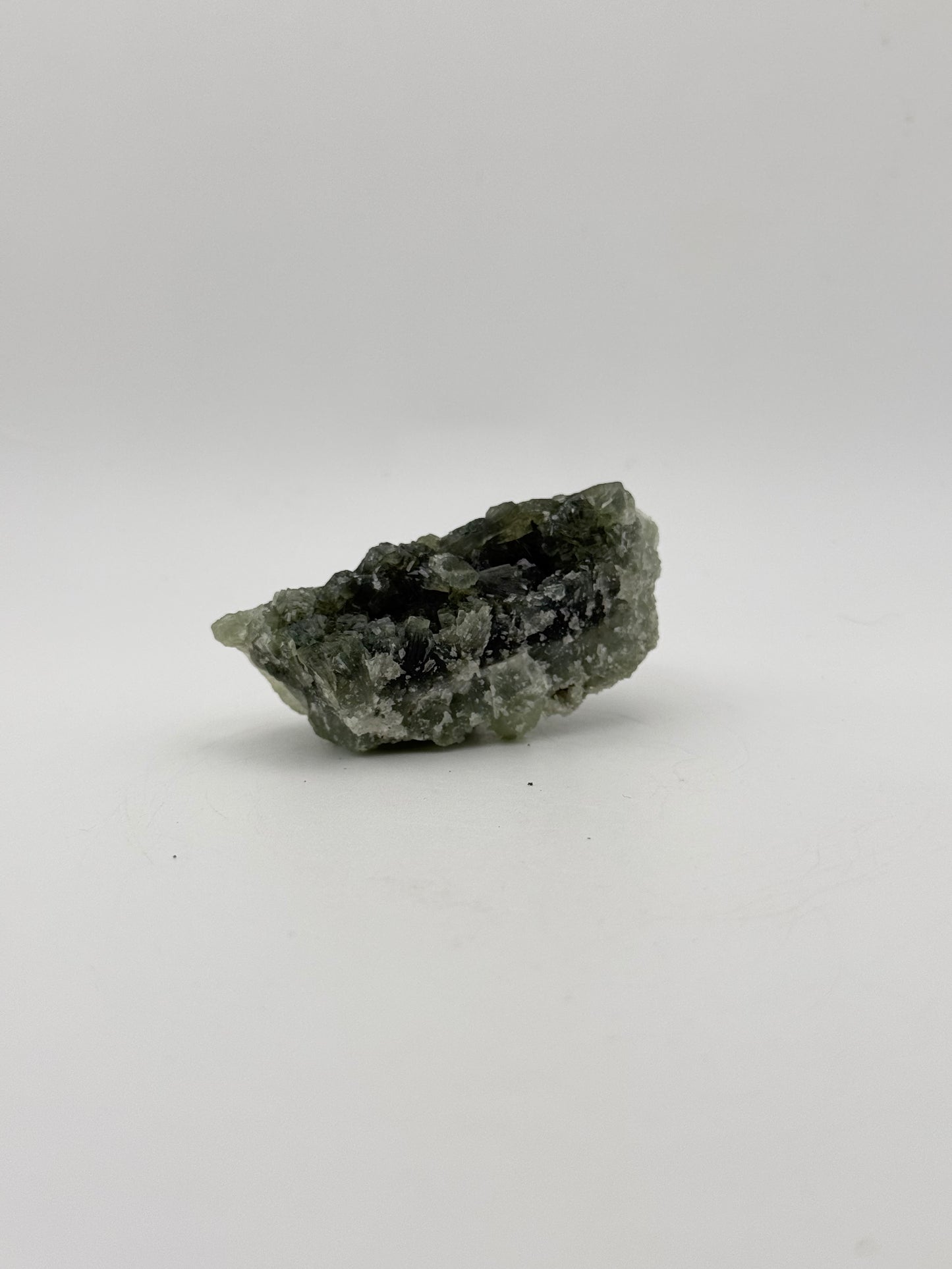 Raw Prehnite specimen with amazing green color.