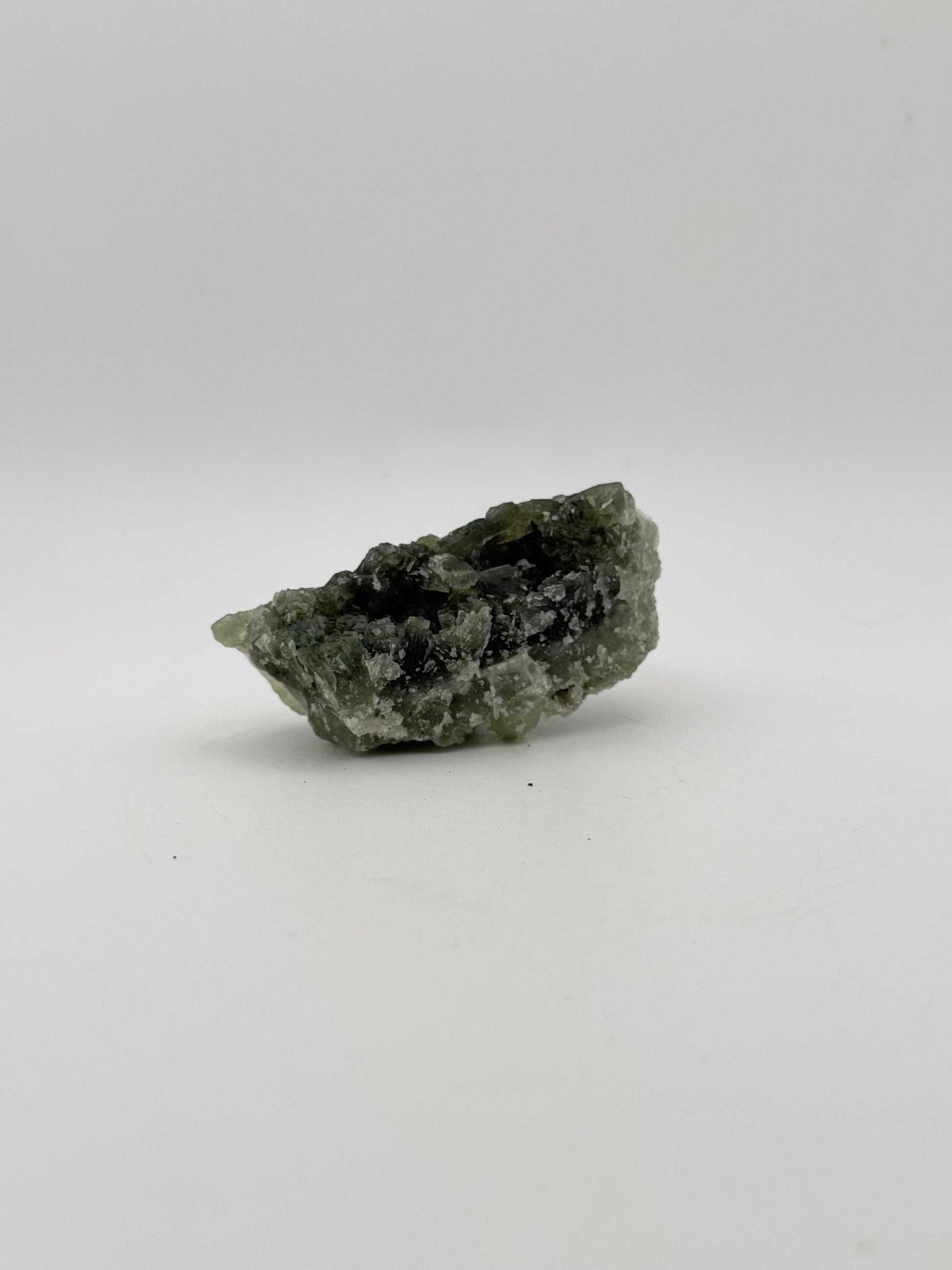 Raw Prehnite specimen with amazing green color.