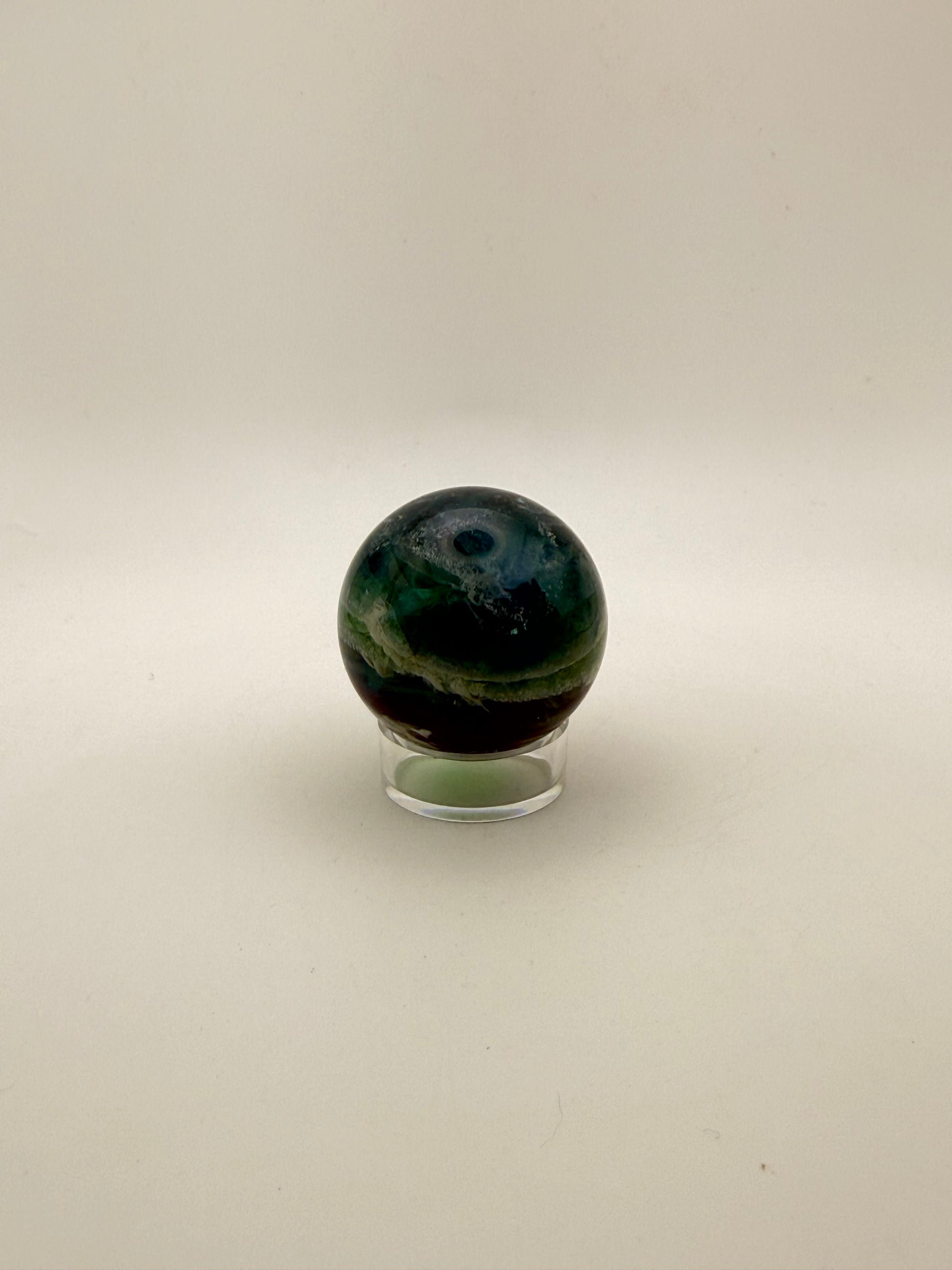 Rainbow Fluorite polished crystal sphere.