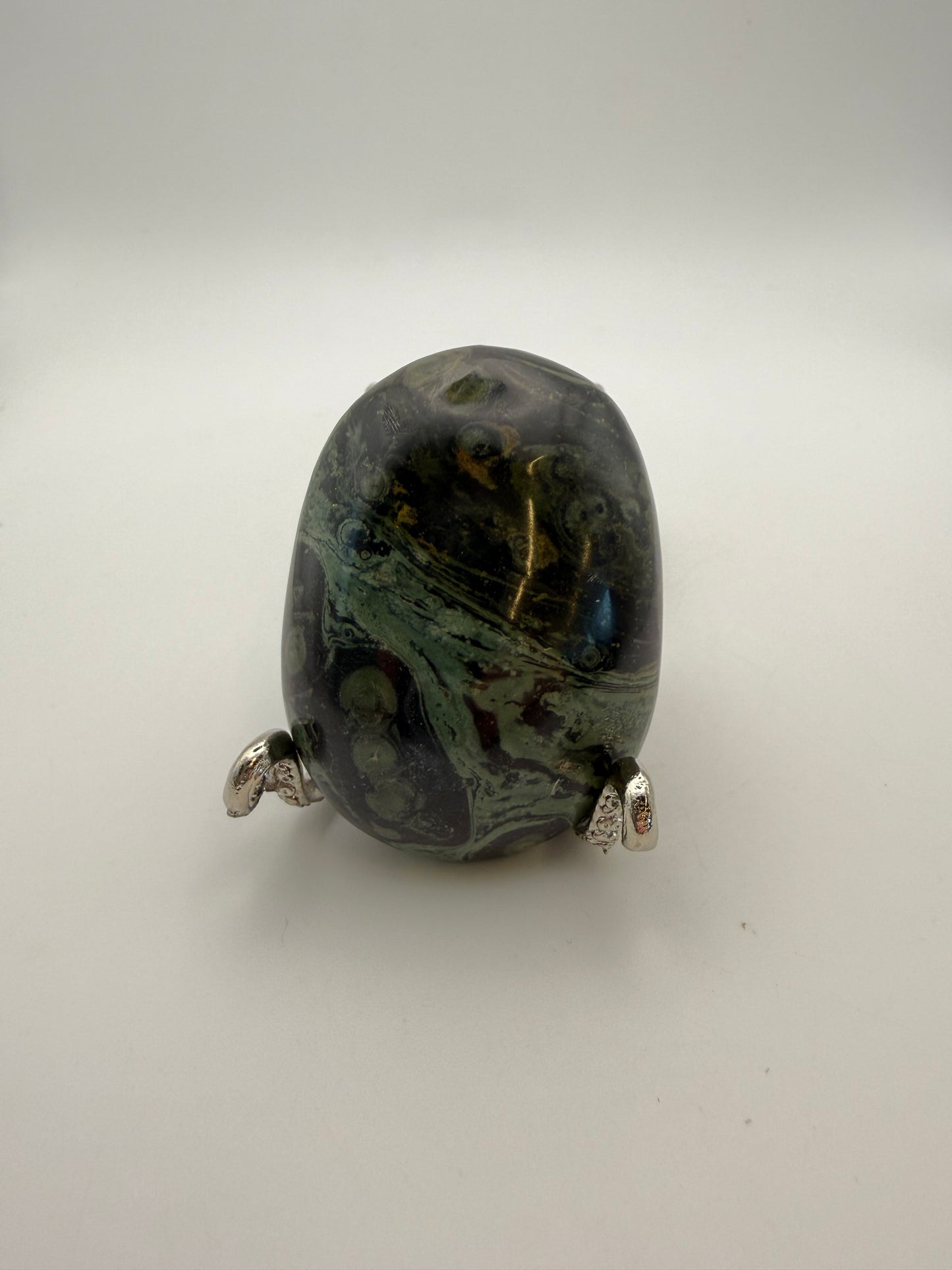 Polished kambaba jasper palm stone.