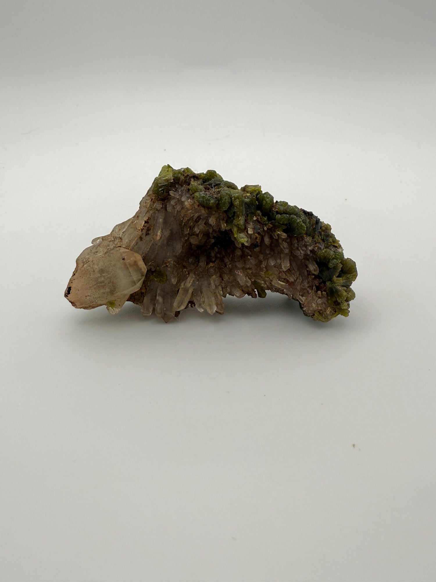 Epidote crystal cluster with good green color.