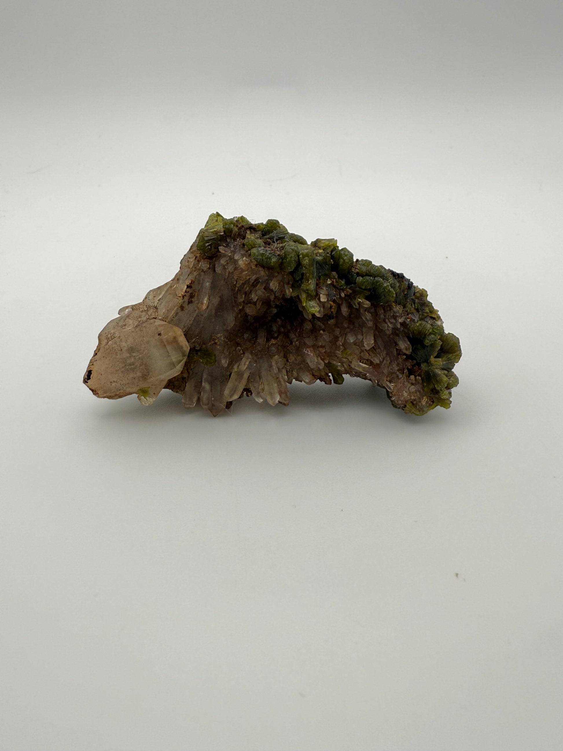 Epidote crystal cluster with good green color.