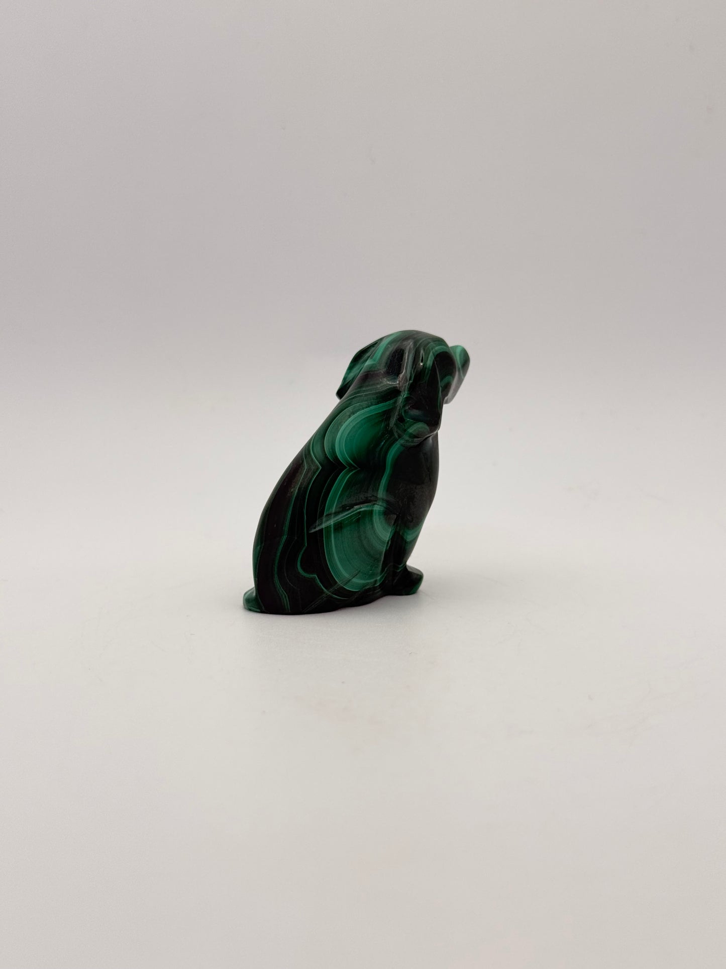Polished malachite dog carving.