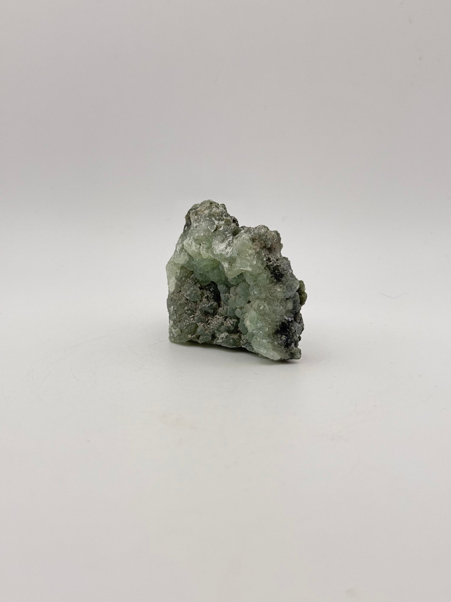 Raw Prehnite specimen with amazing green color.