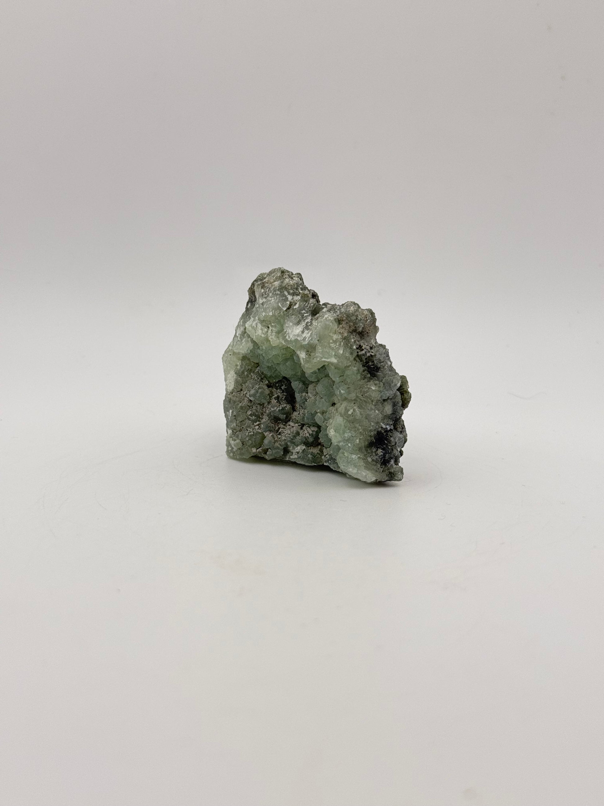 Raw Prehnite specimen with amazing green color.