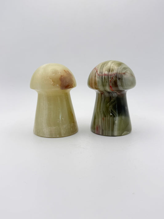 Two onyx mushroom-shaped stones.