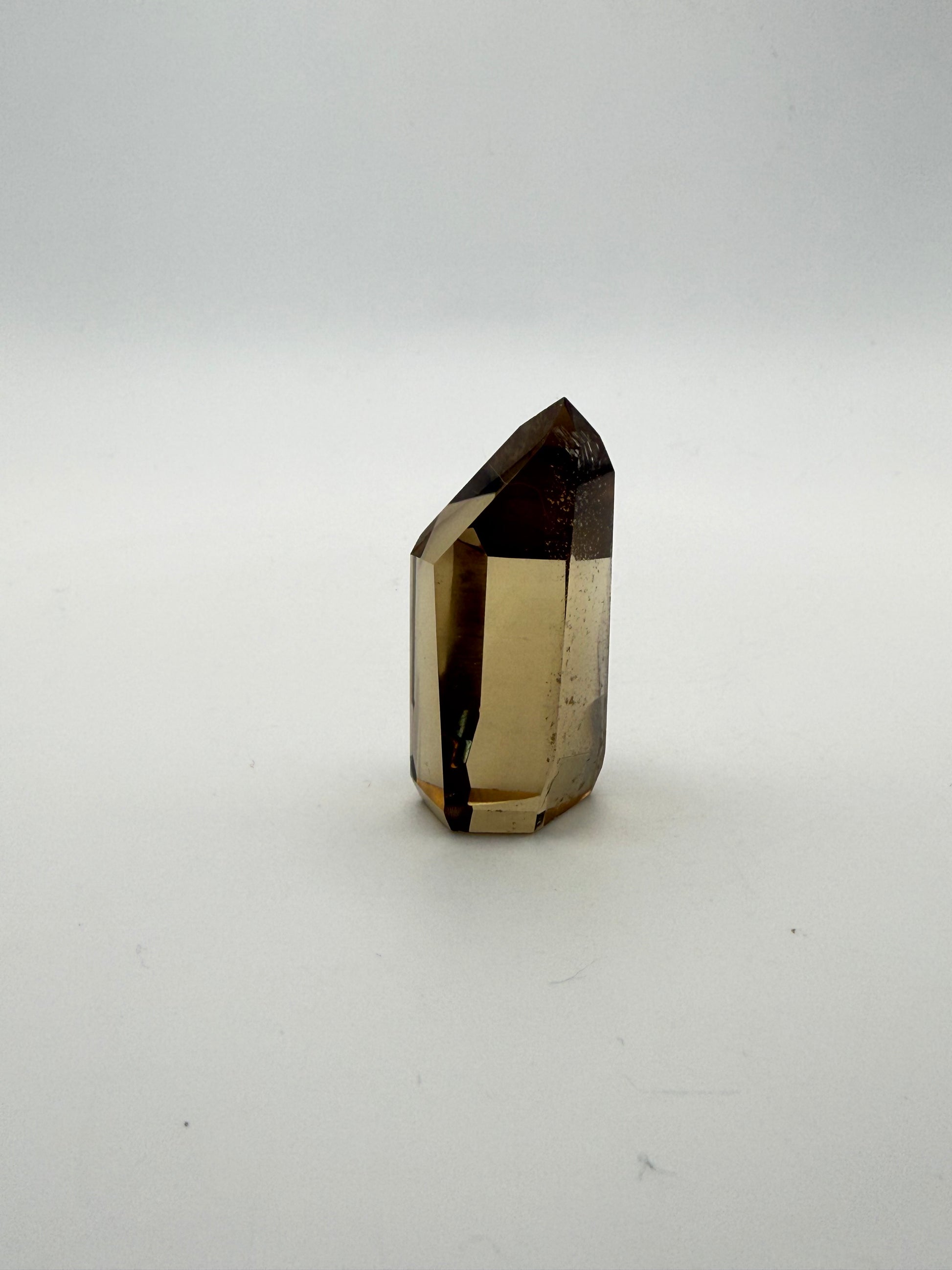 Polished natural citrine point.