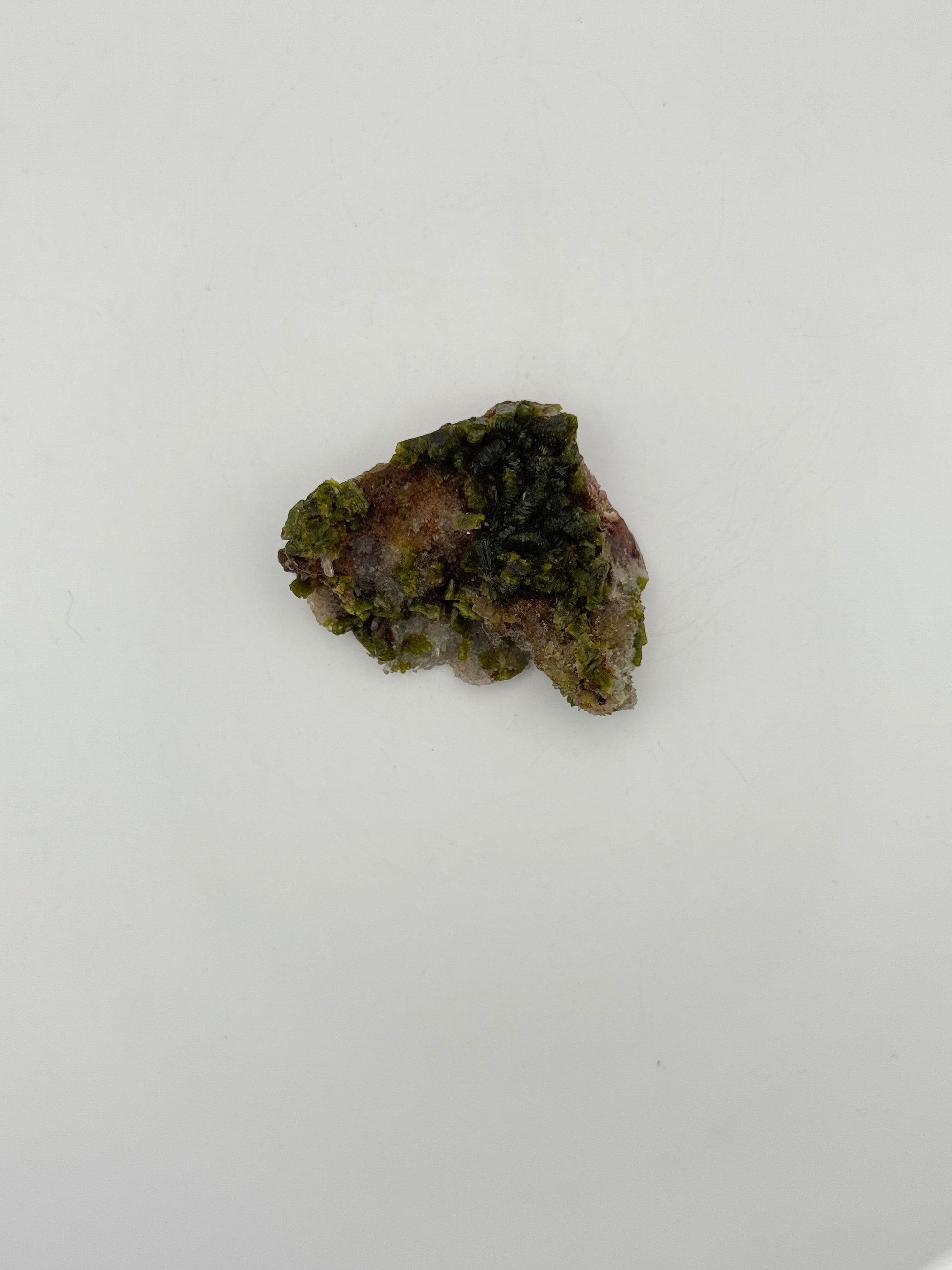 Epidote crystal cluster with good green color.