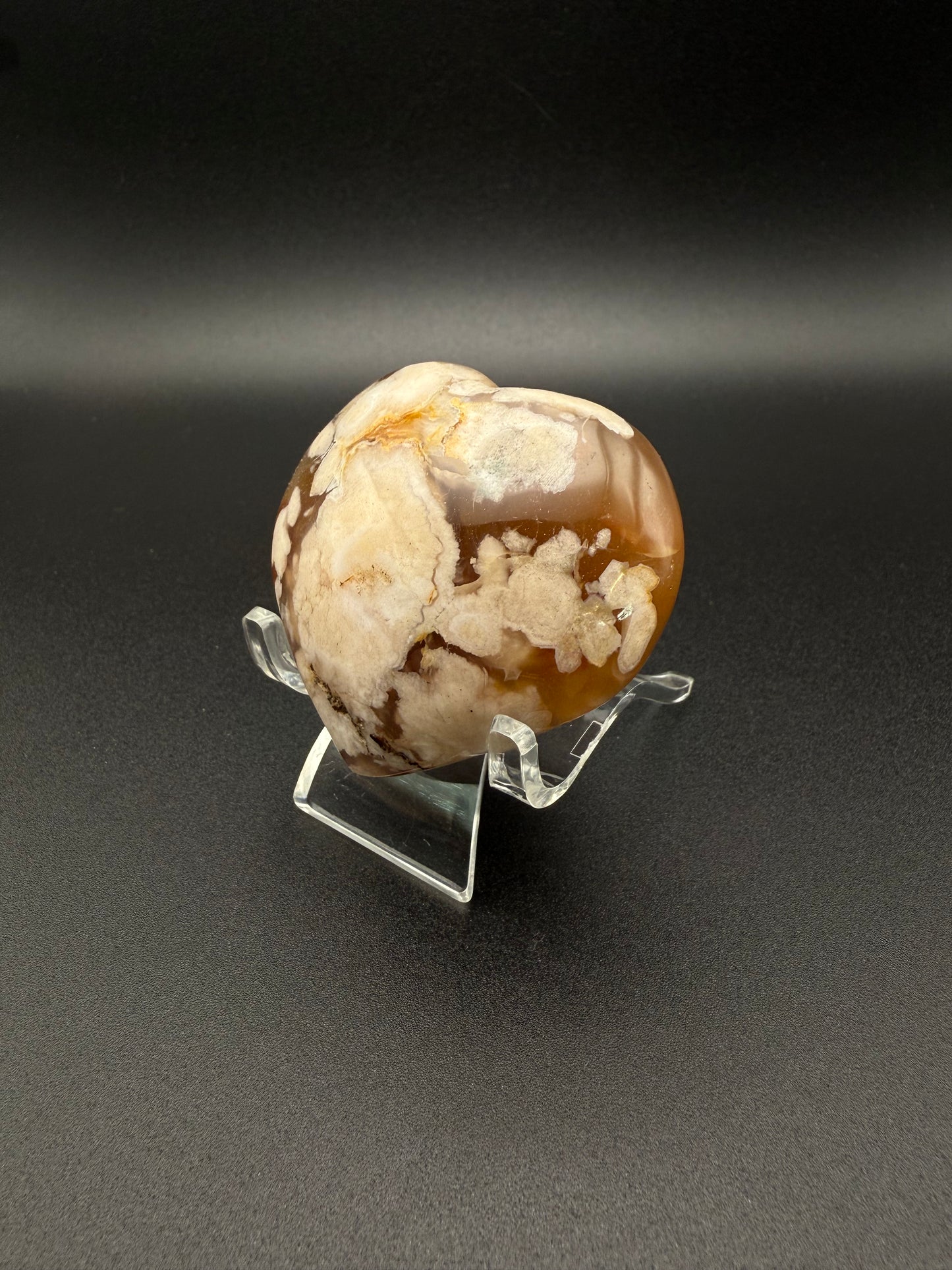 Flower Agate polished crystal in the shape of a heart.