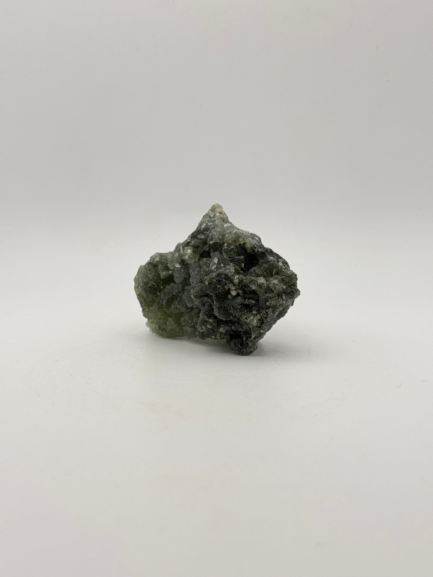 Raw prehnite specimen with good green coloring.