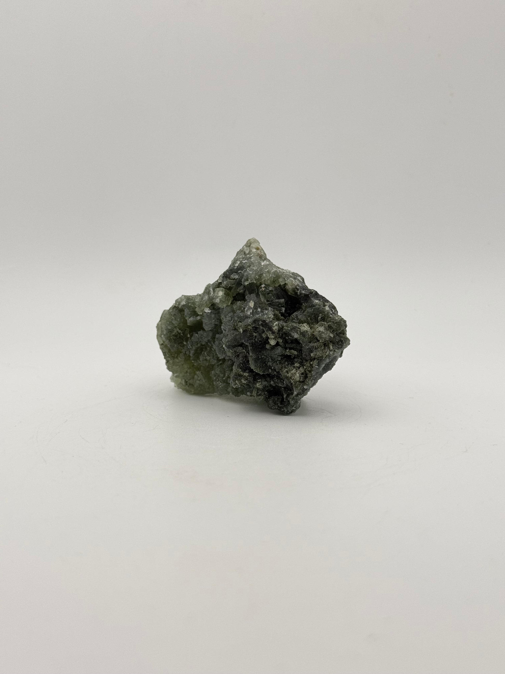 Raw prehnite specimen with good green coloring.