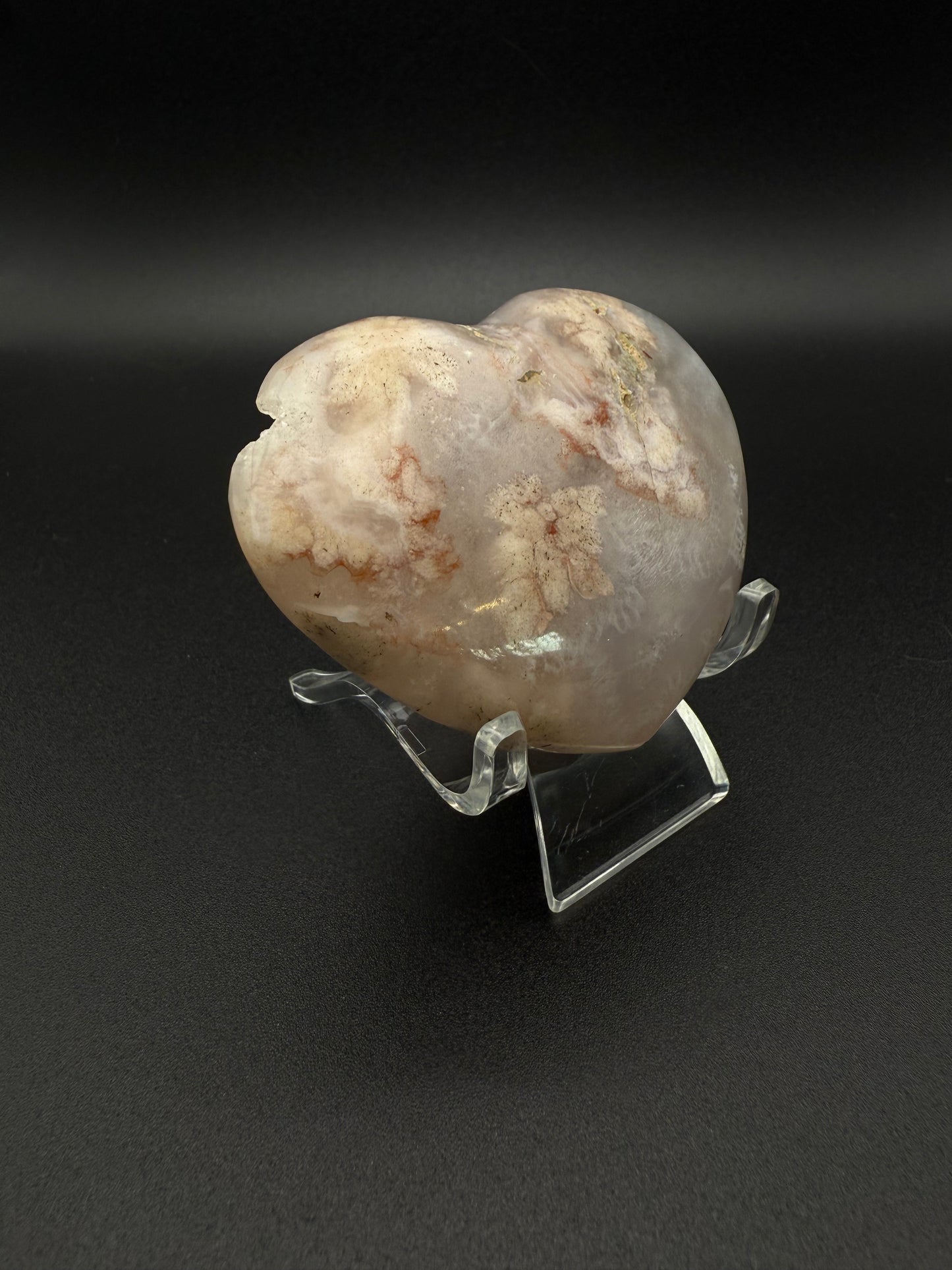 Heart-shaped polished flower agate crystal.
