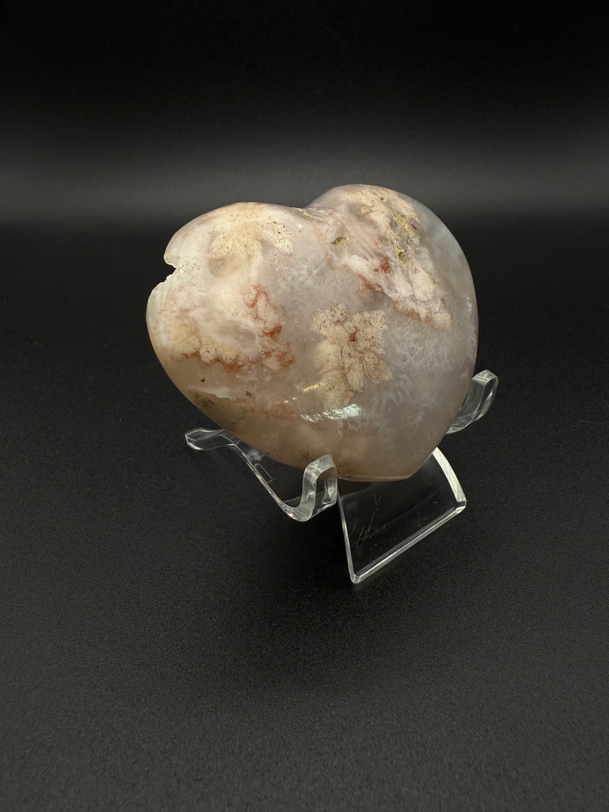 Heart-shaped polished flower agate crystal.