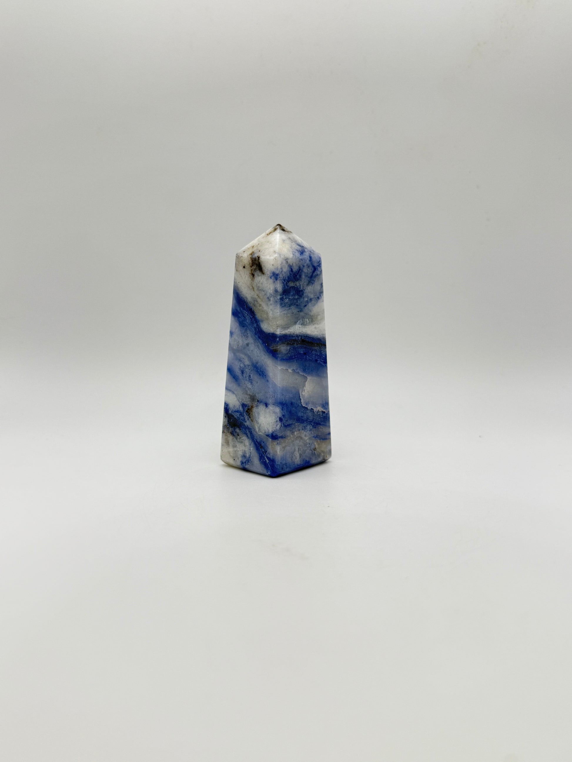 Afghanite four sided tower. Height of 3 1/4 inches, width of 1 1/4 inches.
