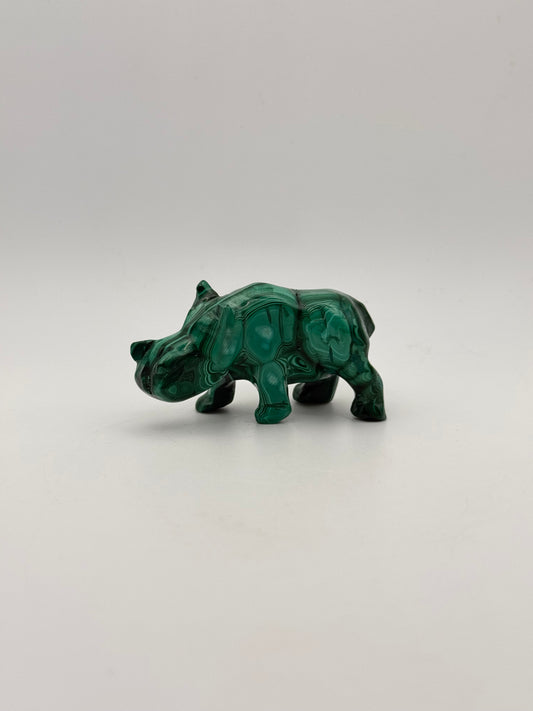 Vibrant green malachite stone carving of a rhino.