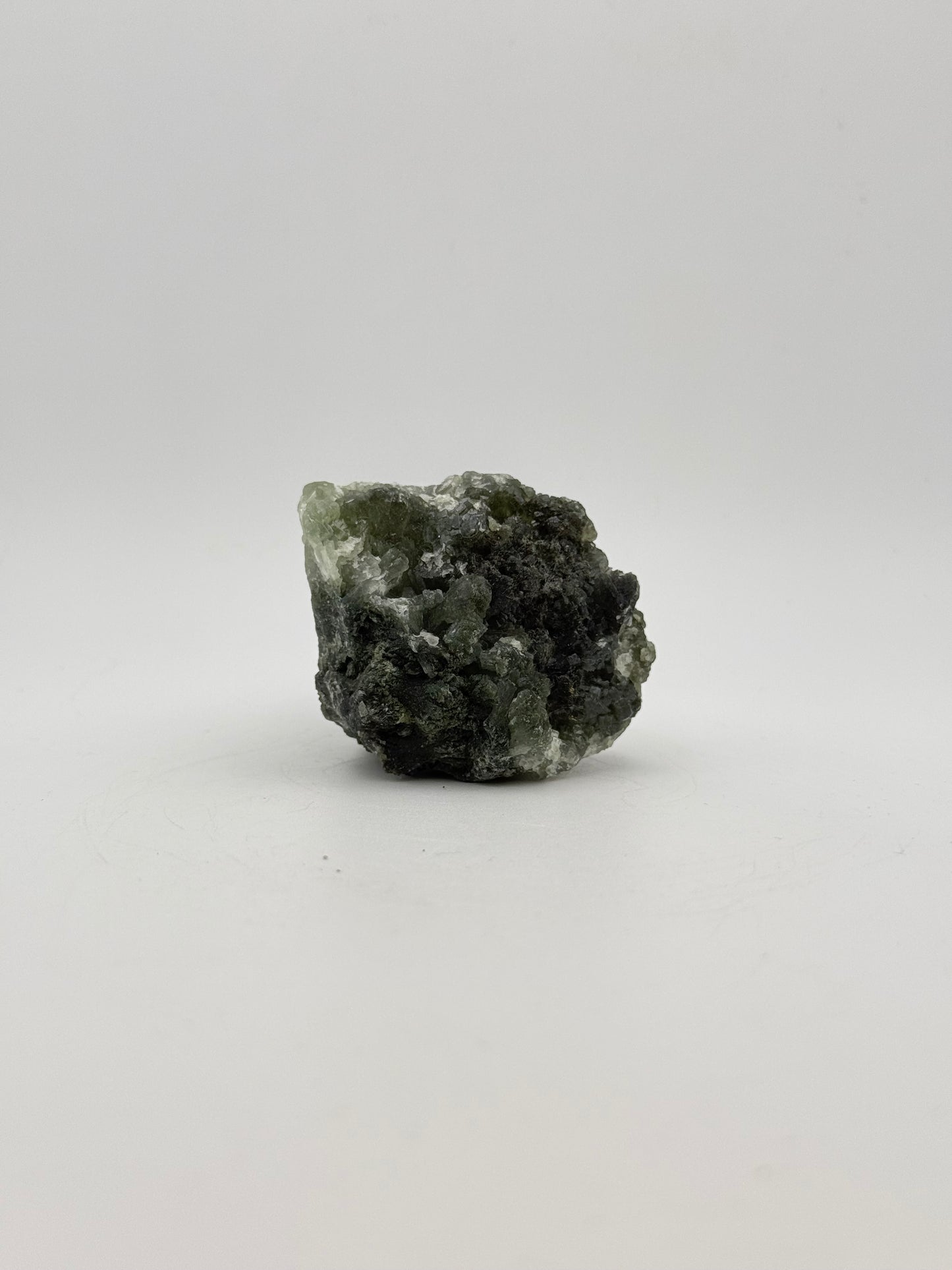 Raw Prehnite specimen with amazing green color.