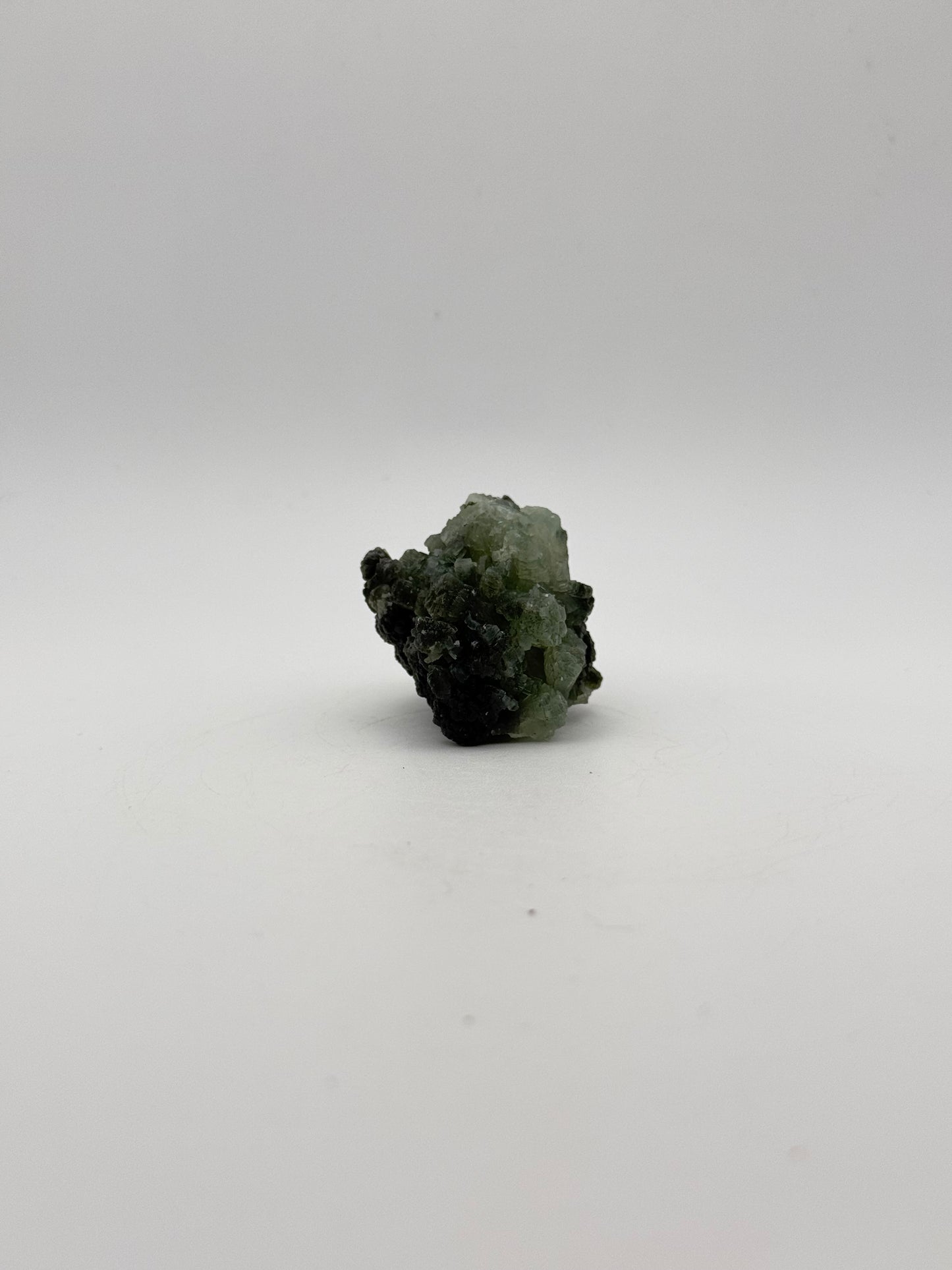 Raw Prehnite specimen with amazing green color.