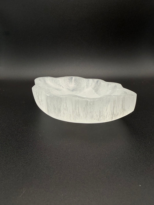 Selenite bowl in the shape of a leaf.