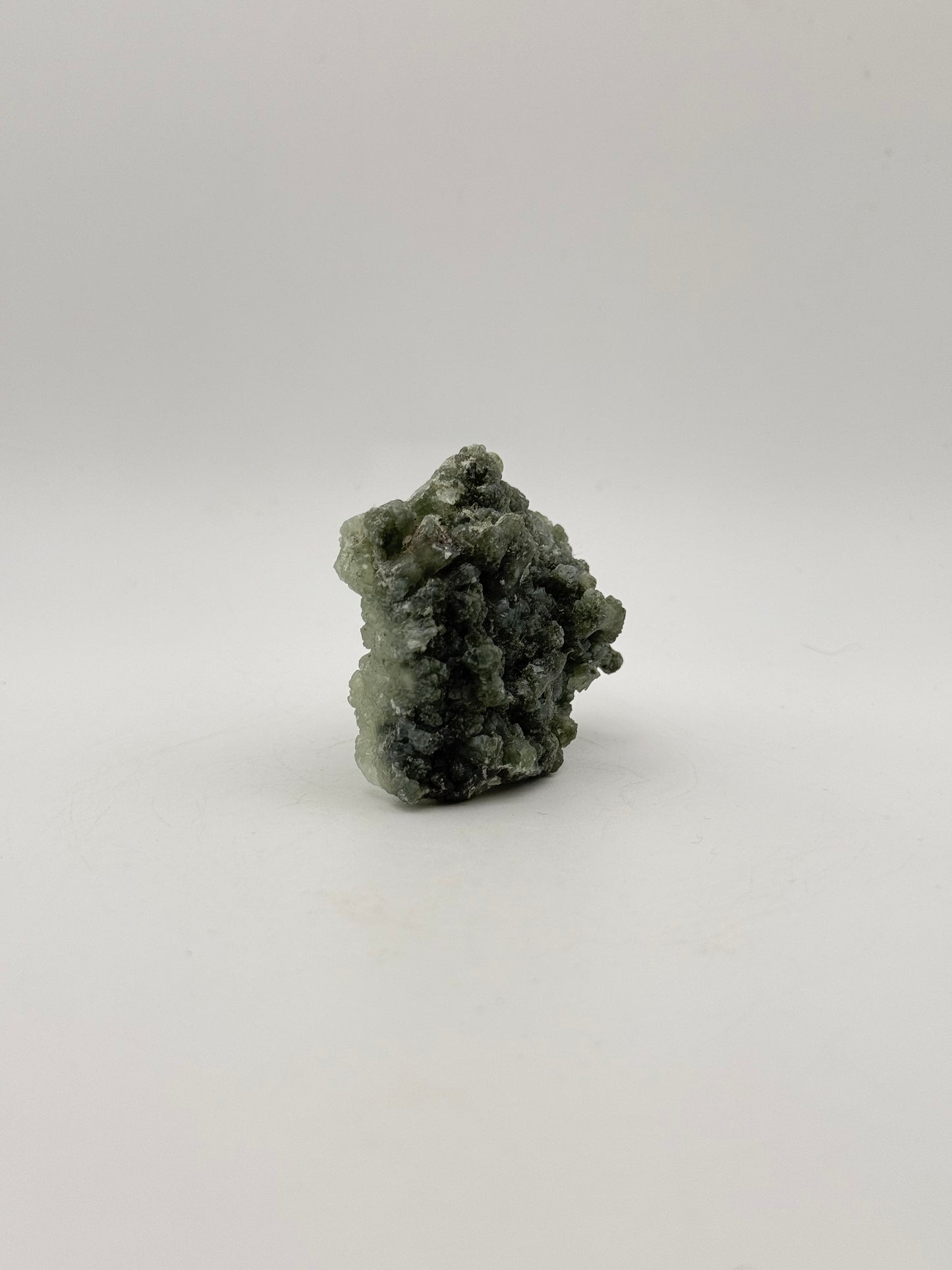 Raw Prehnite specimen with amazing green color.