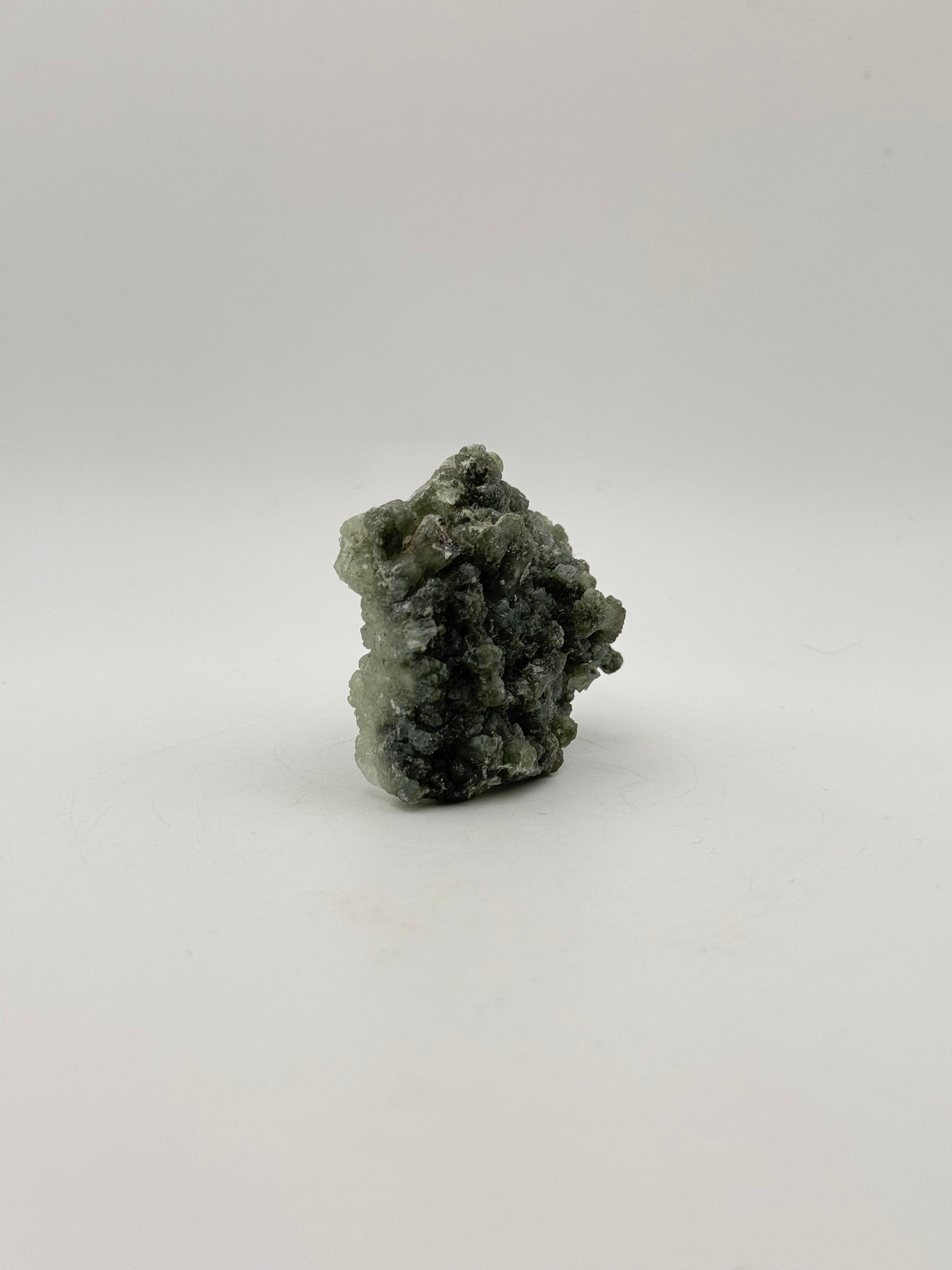 Raw Prehnite specimen with amazing green color.