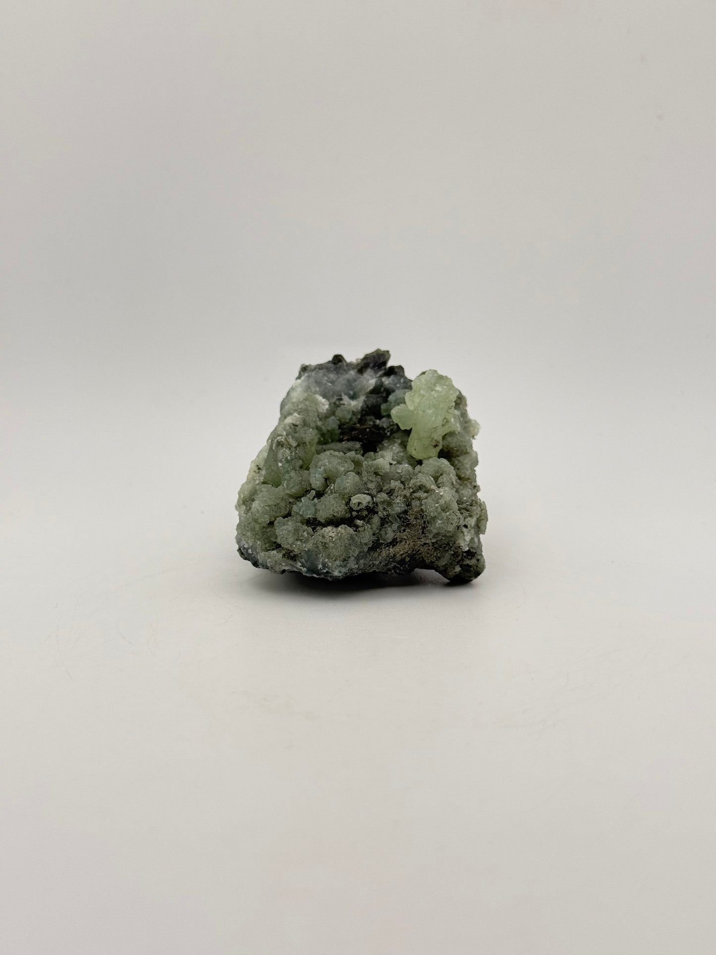 Raw Prehnite specimen with amazing green color.