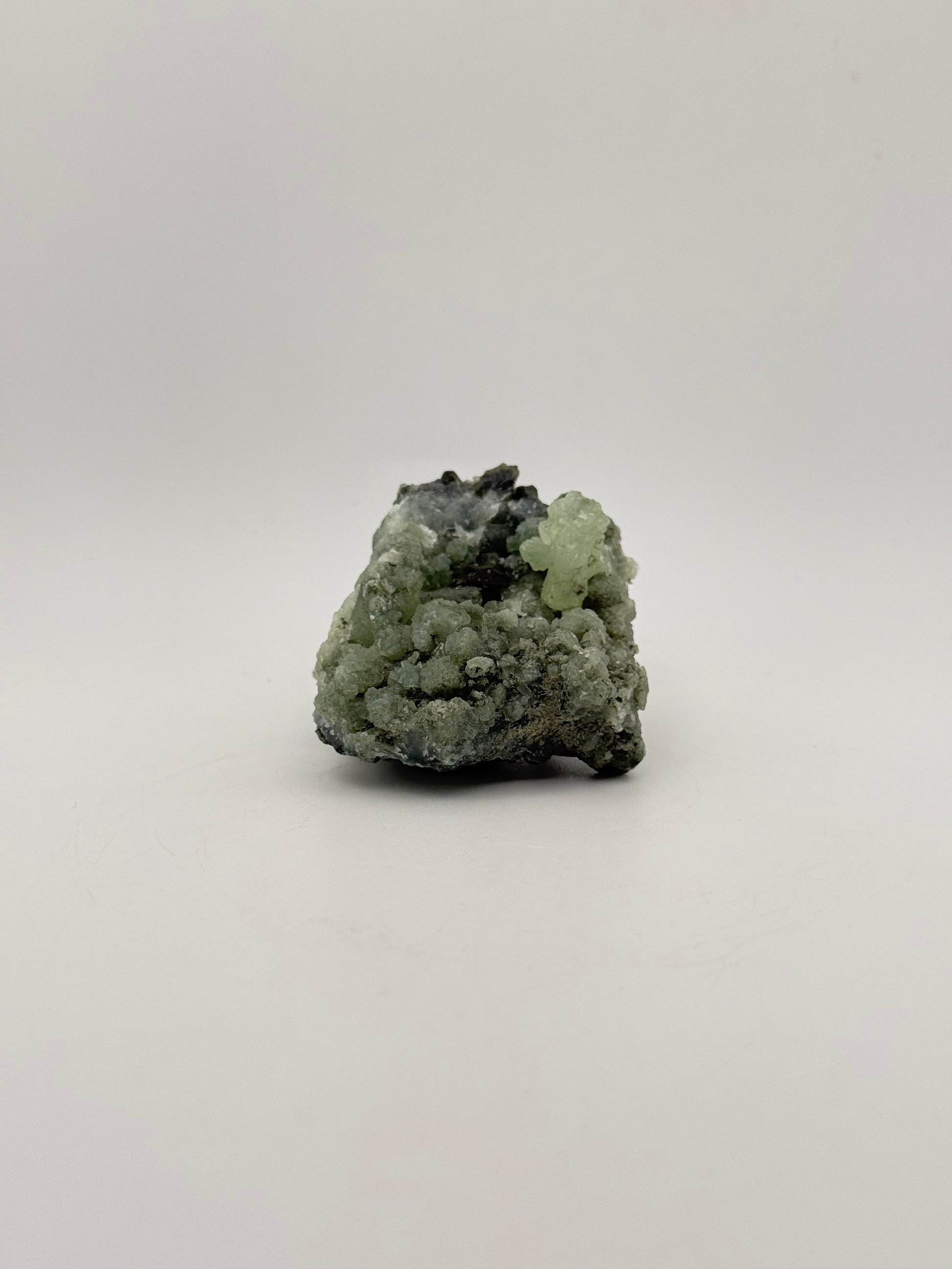 Raw Prehnite specimen with amazing green color.