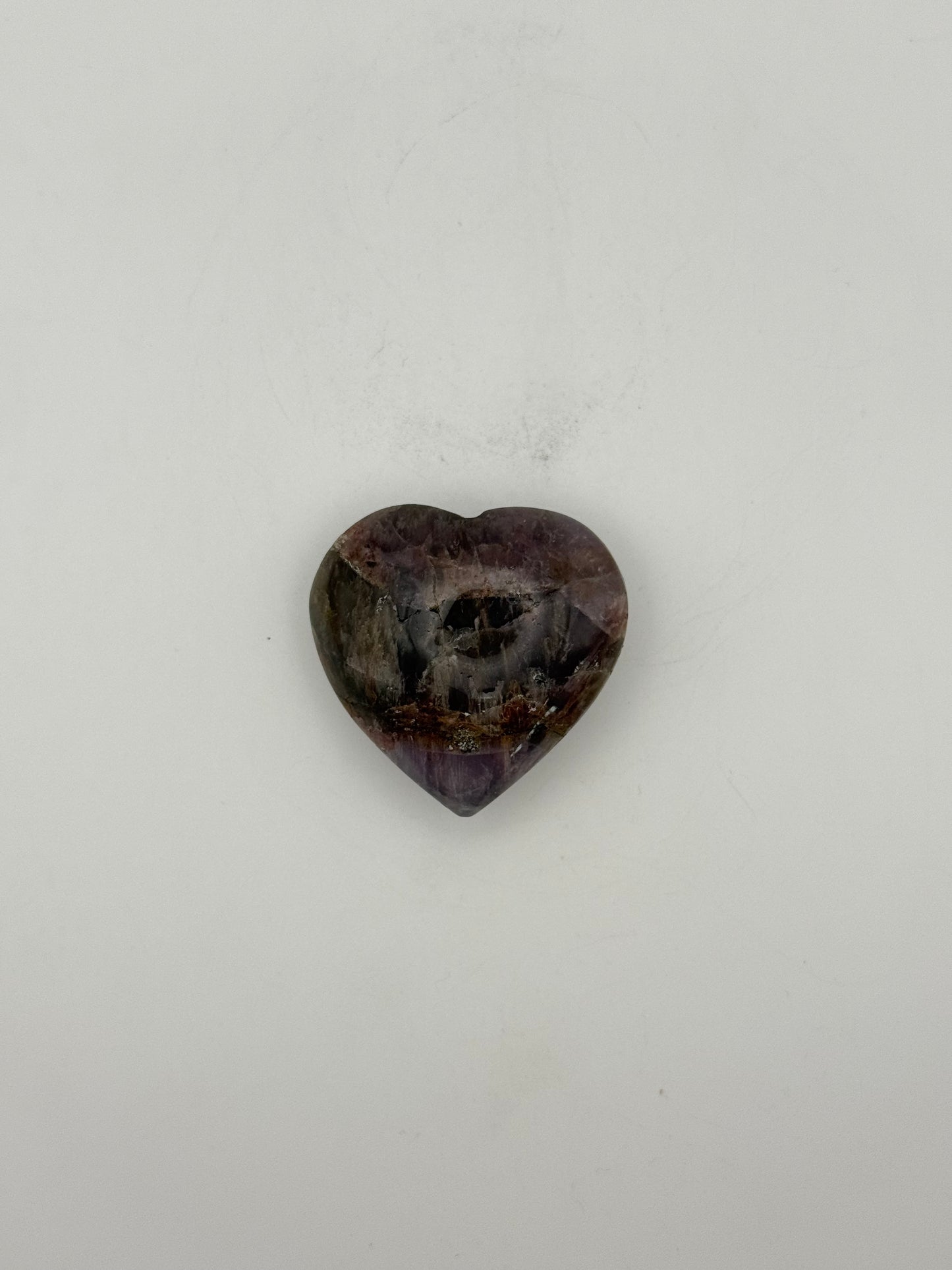 Polished super 7 in the shape of a heart.