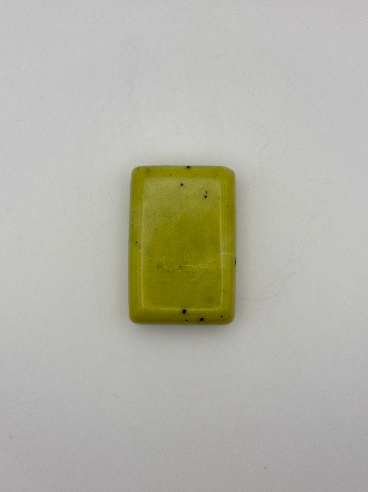 Polished healerite in the shape of a rectangular soap.