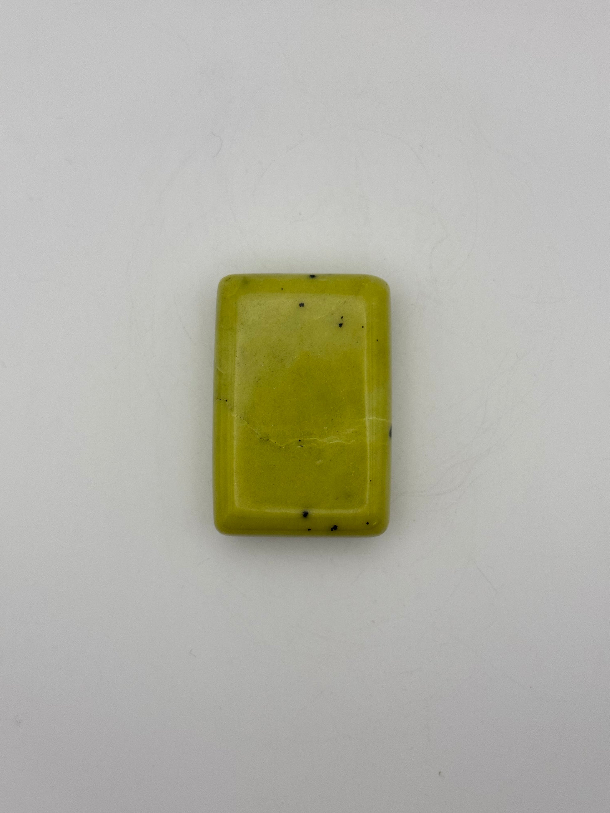 Polished healerite in the shape of a rectangular soap.